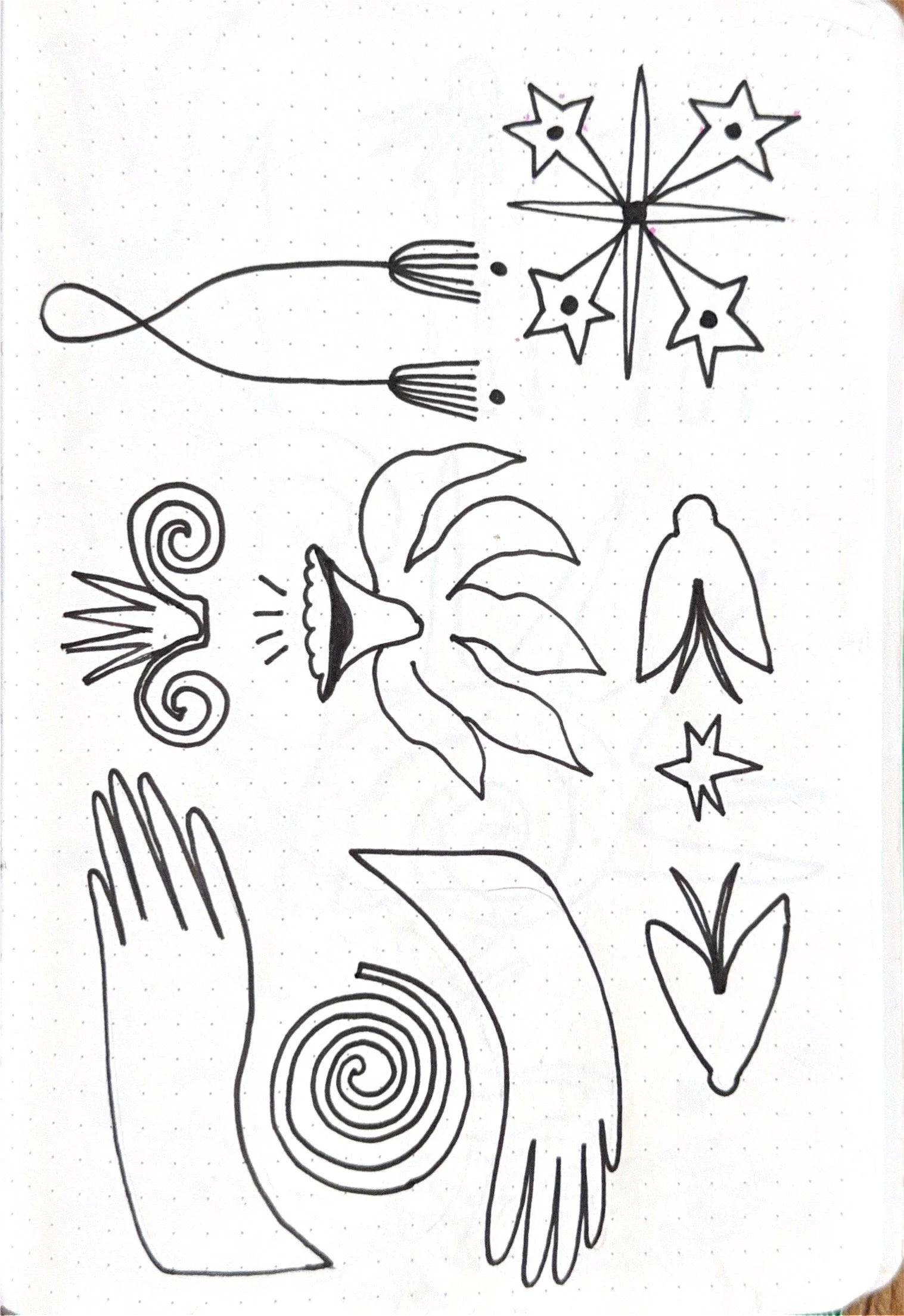 Black and white line drawing of abstract shapes and flowers on white paper.