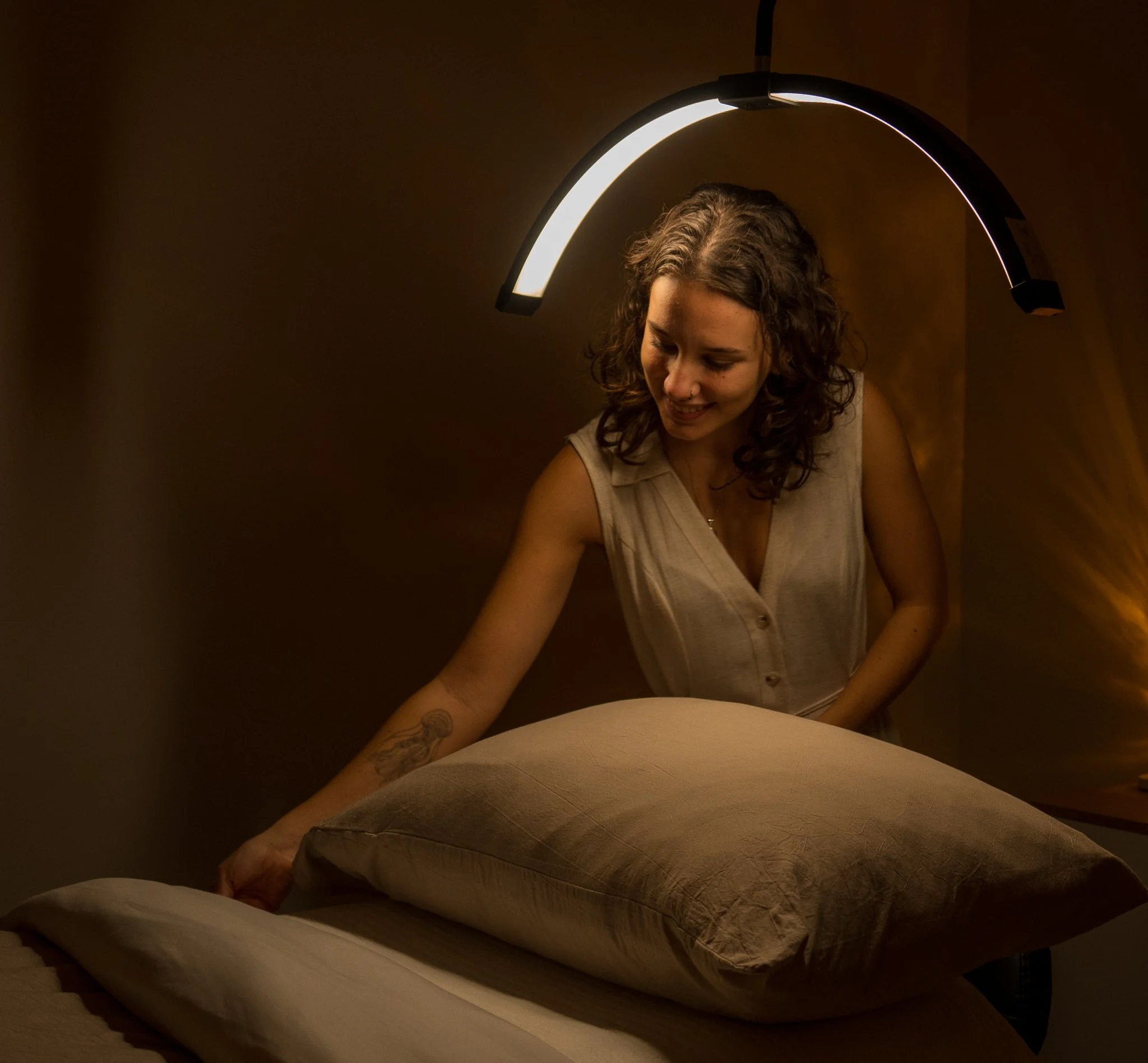 Holistic skin therapist preparing a treatment room for a personalised skin consultation and professional facial in Dunsborough.