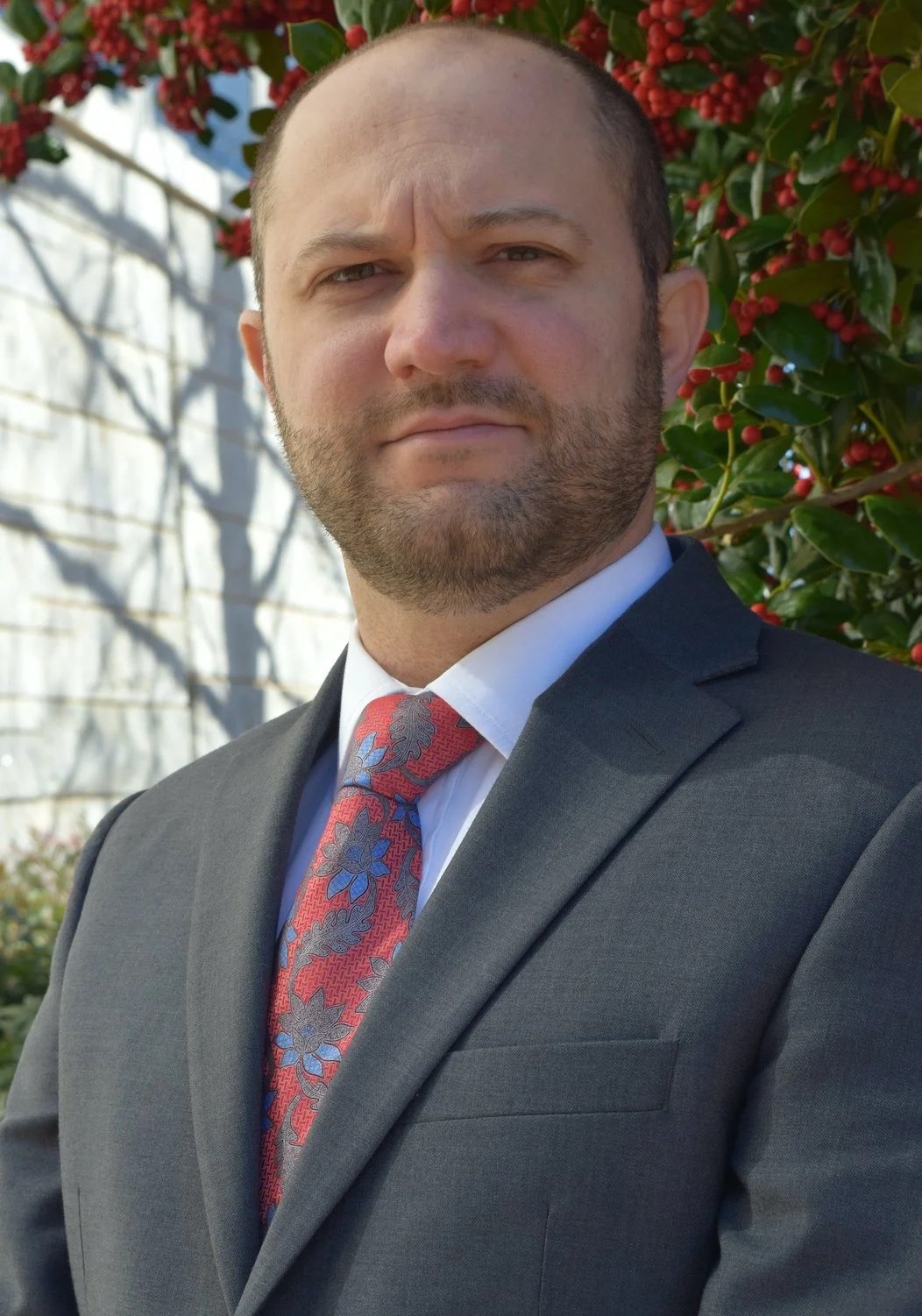 Attorney Mahmoud Khatib, with a neatly trimmed beard and an elegant suit and tie, has a deeply serious and intelligent look of a seasoned lawyer.