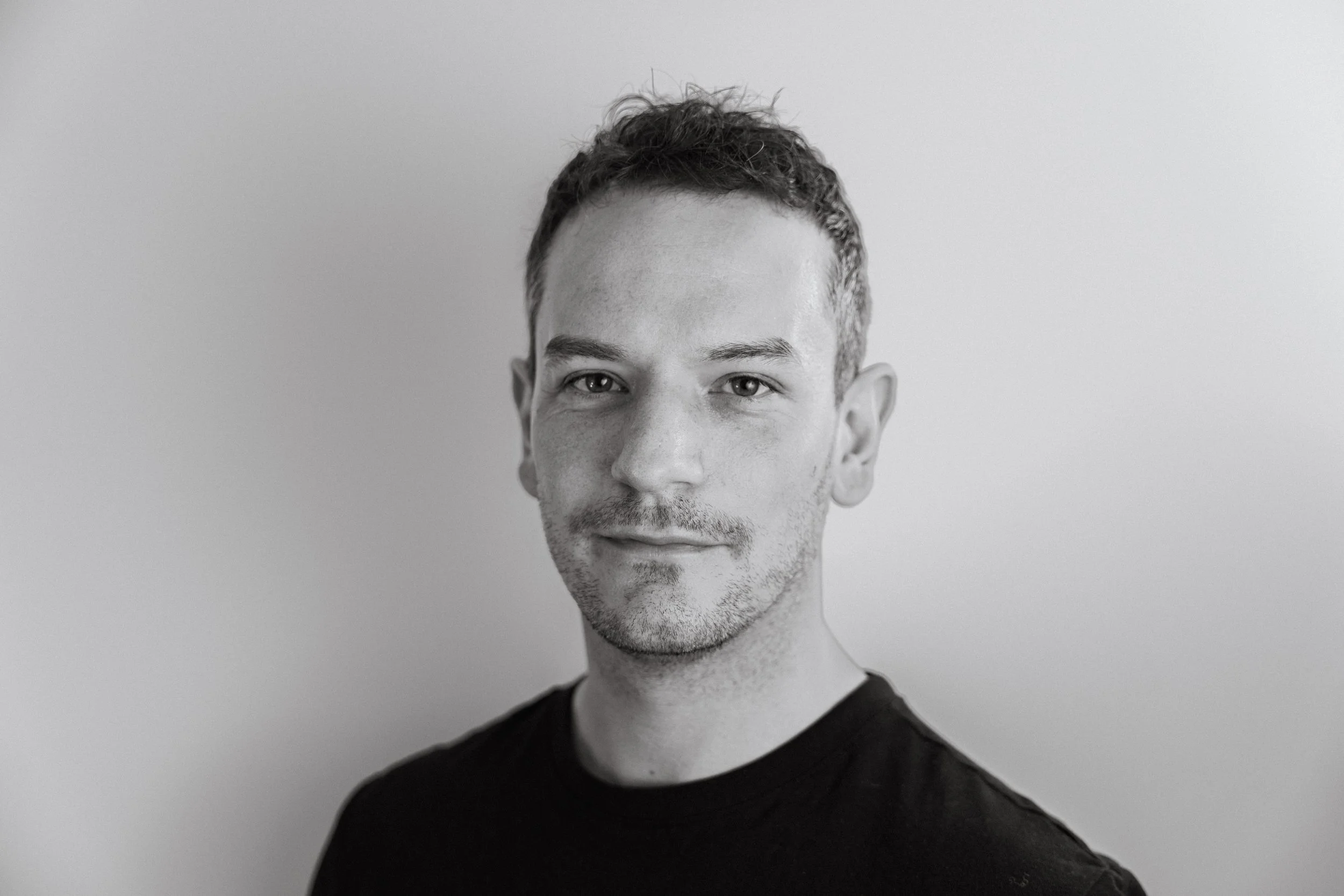 Black and white photograph of photographer and videographer, James ak Bennett