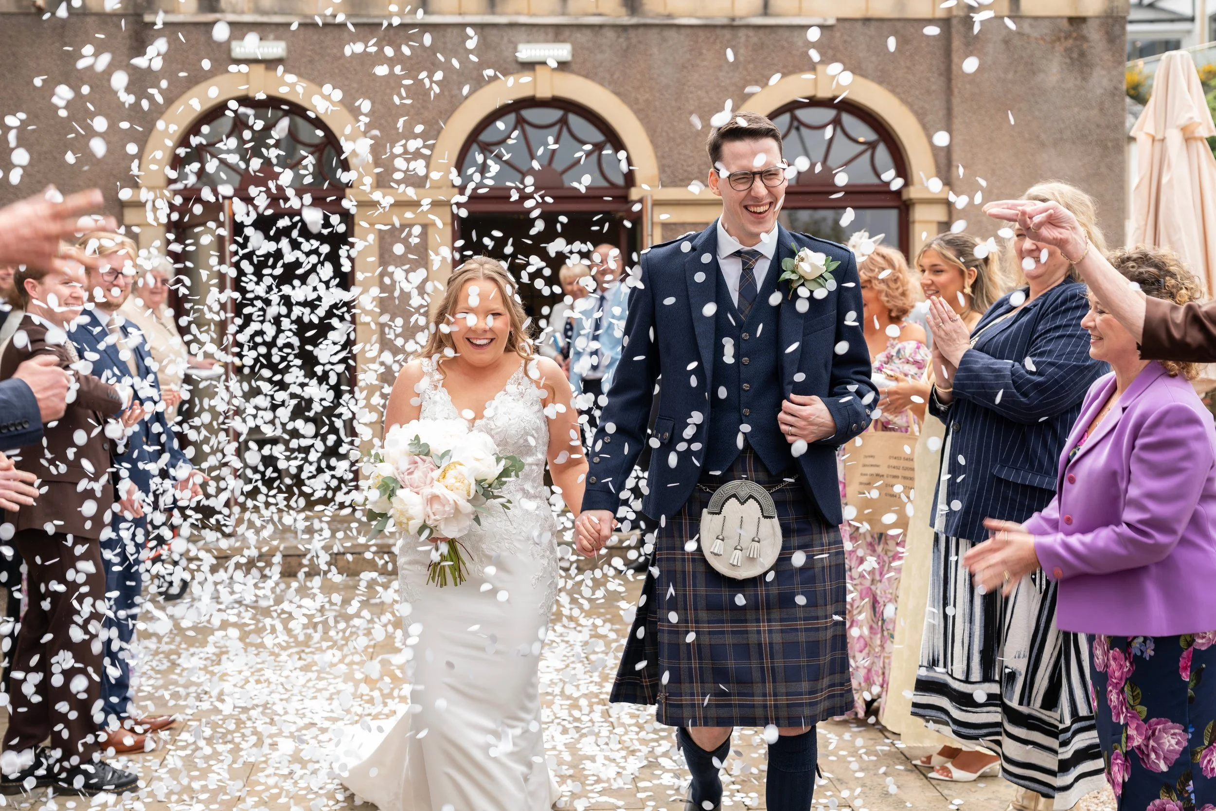 bride_and_groom_confetti_shot_gleddoch_hotel.jpg