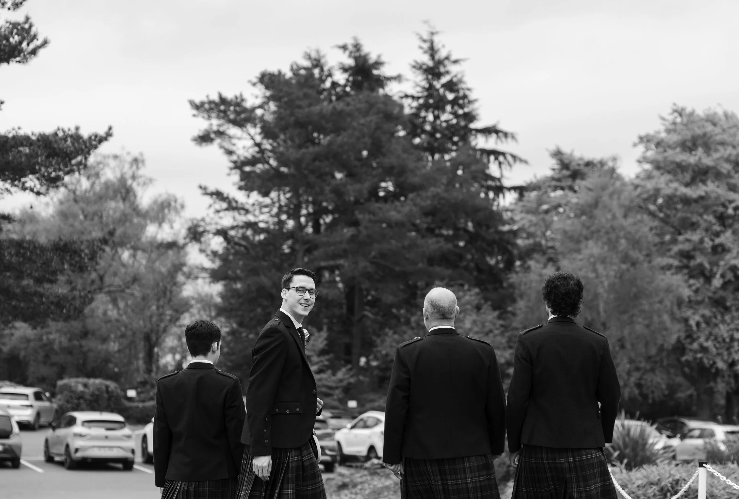 Groom_&_groomsmen_walking_gleddoch_hotel.jpg