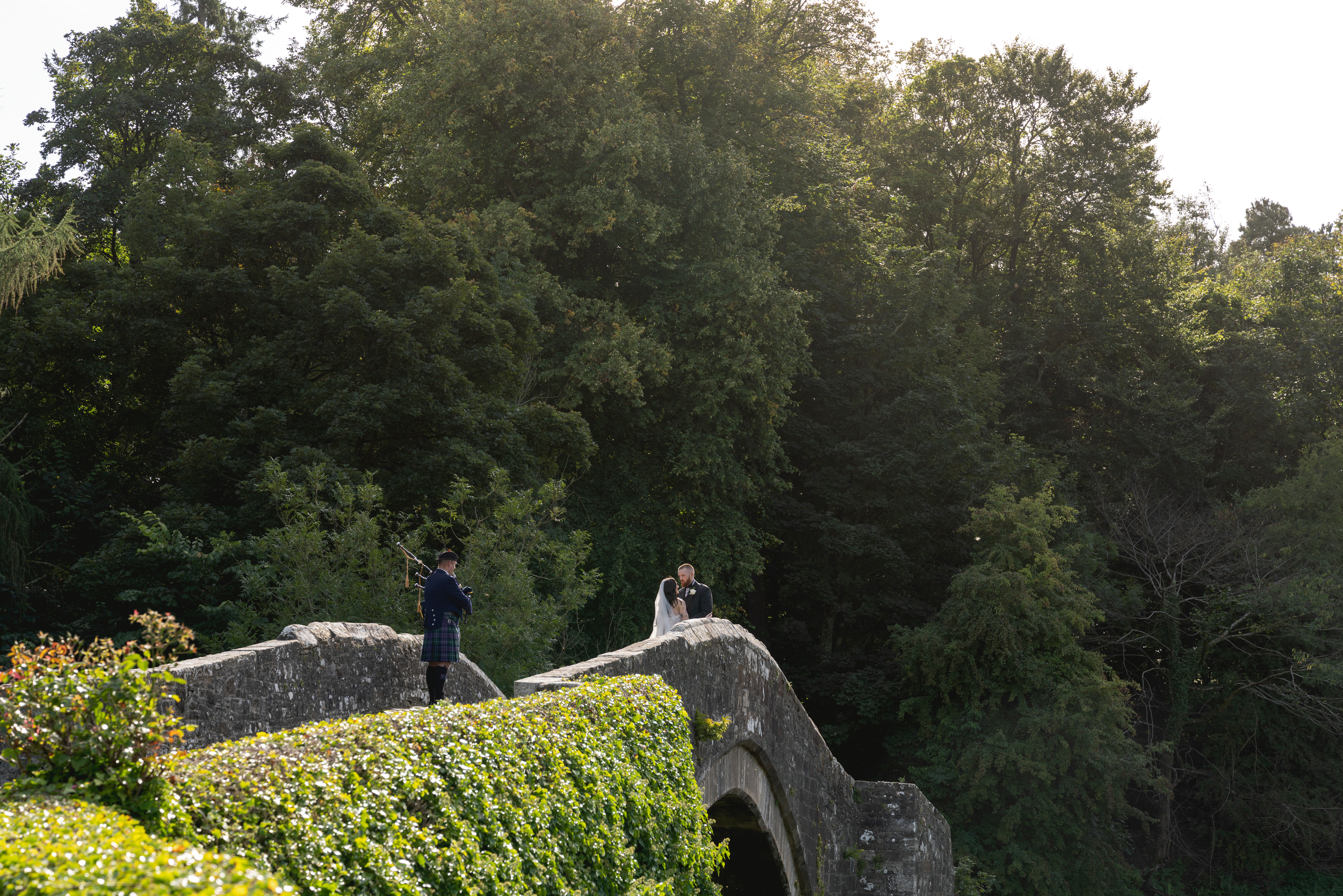 Brig a doon wedding, Bride and Groom standing on the famous brig o doon