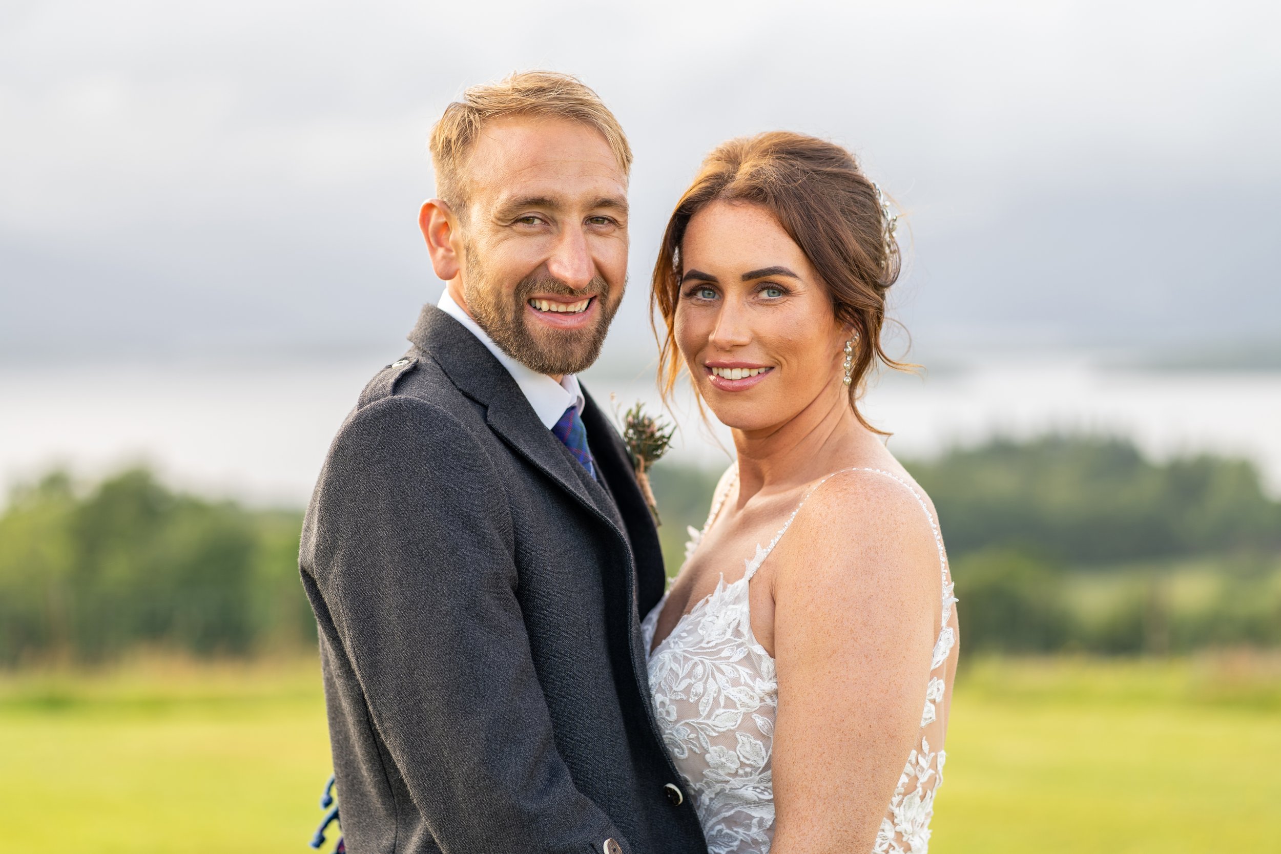Bride and Groom portrait looking straight into the camera at Ardoch Loch Lomond