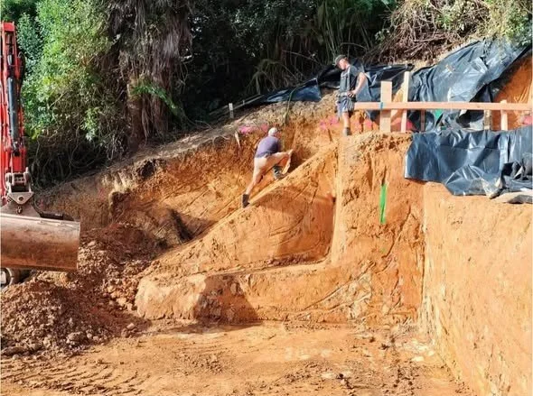 Large retaining wall holes being bored for retaining wall