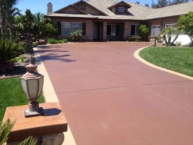 and example of coloured concrete to enhance the look of clients driveway