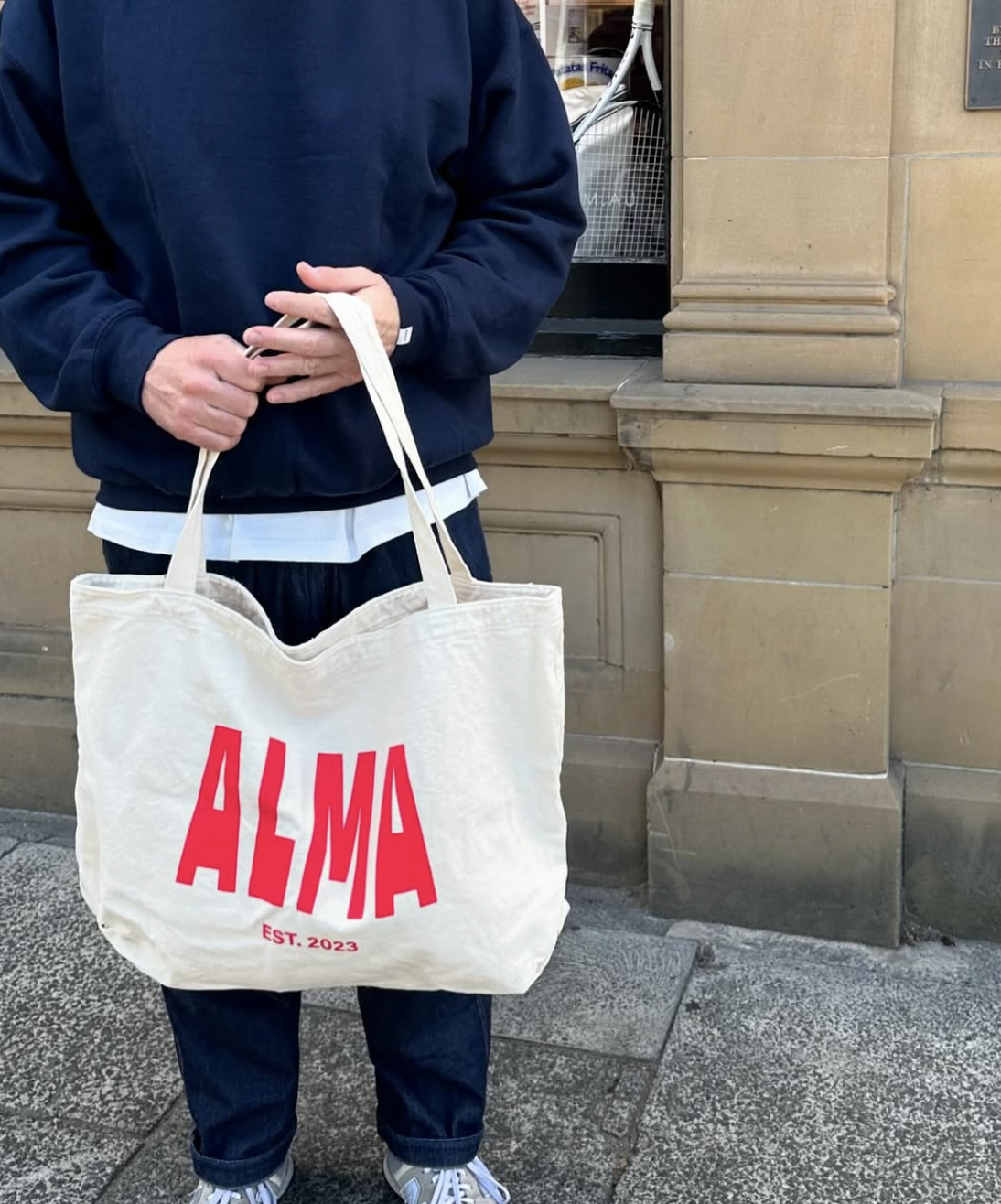 The name ALMA on a white tote bag from Alma Supply Store in Hobart, Tasmania