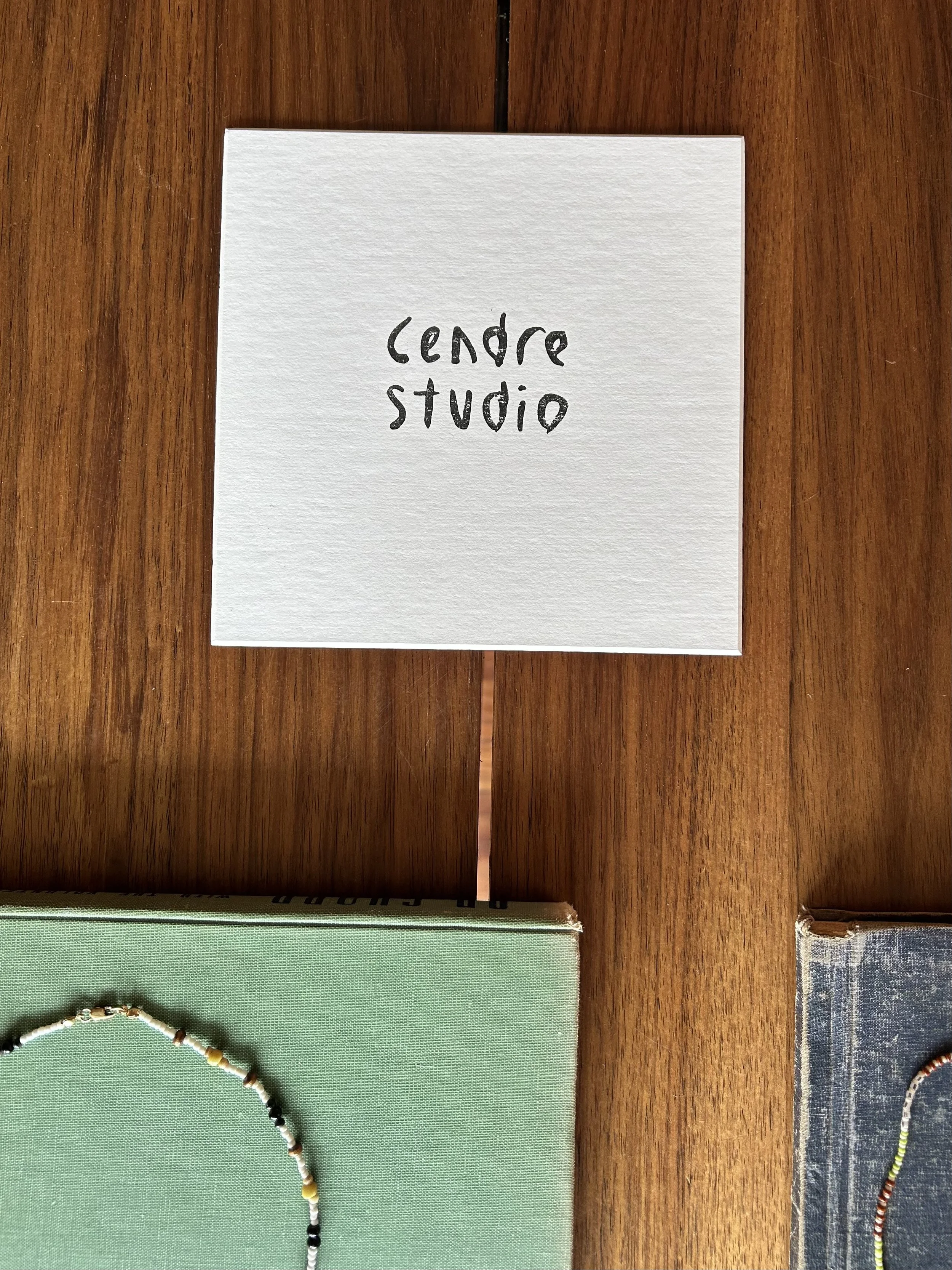 Cendre studio logo on wooden bench