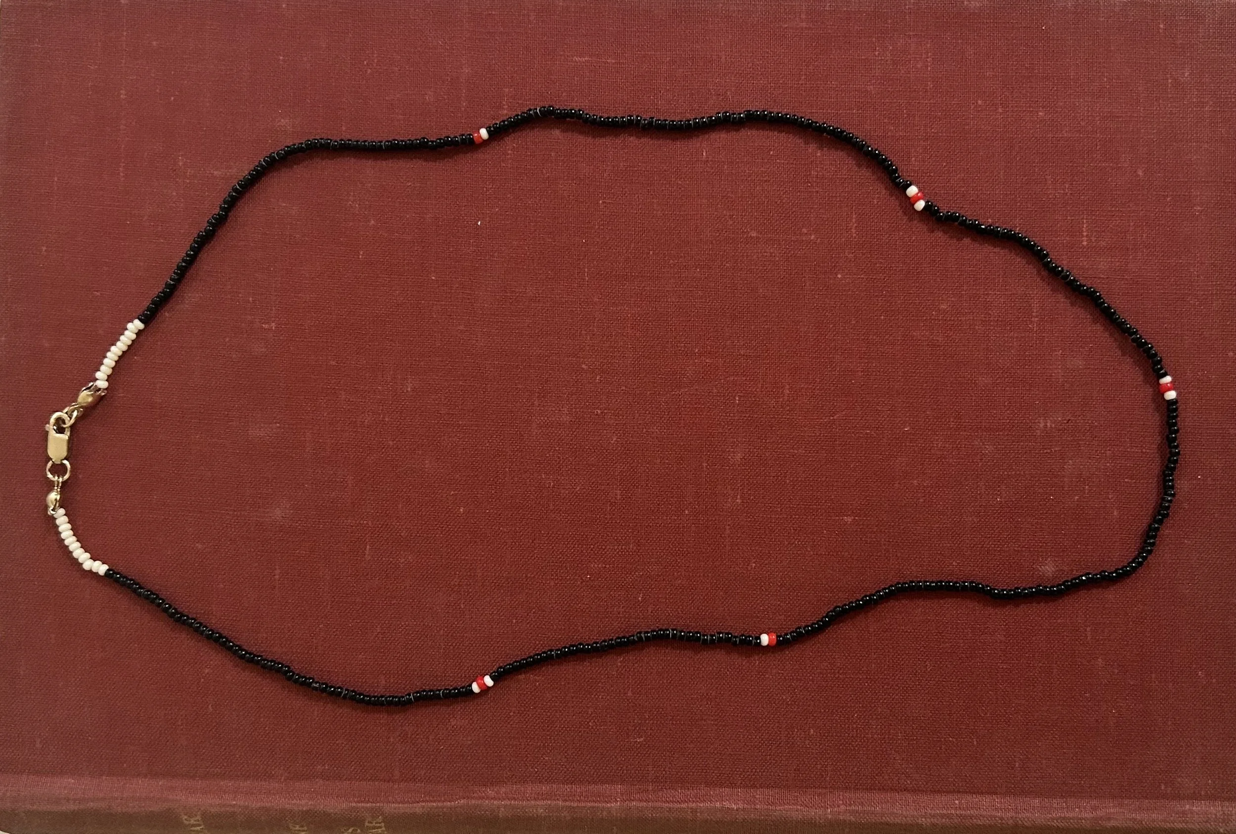 Antique hand-blown black glass, speckled with white and red glass beaded necklace