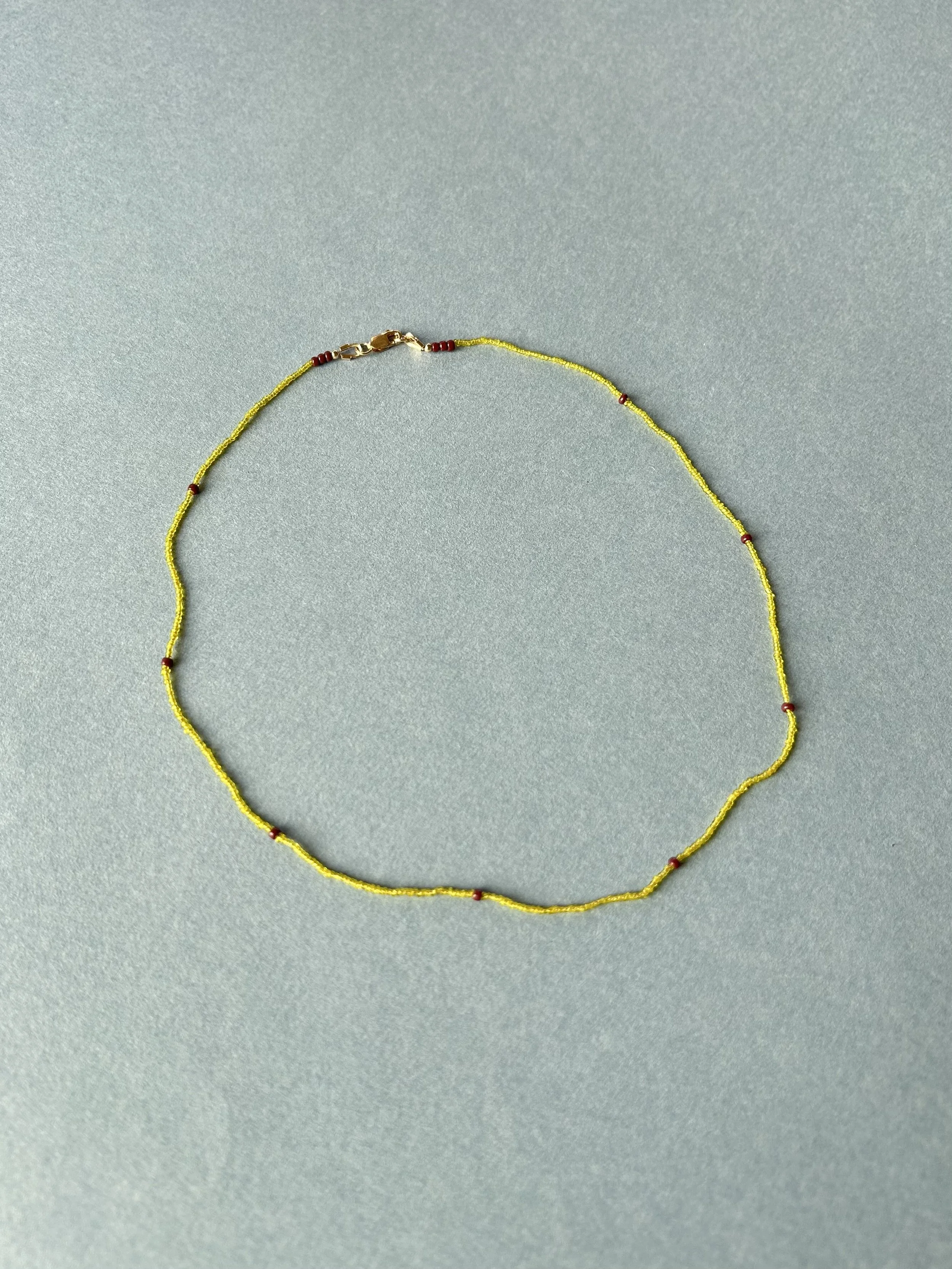 Hand-blown antique glass beads on silk cord with 14k gold filled clasps and findings