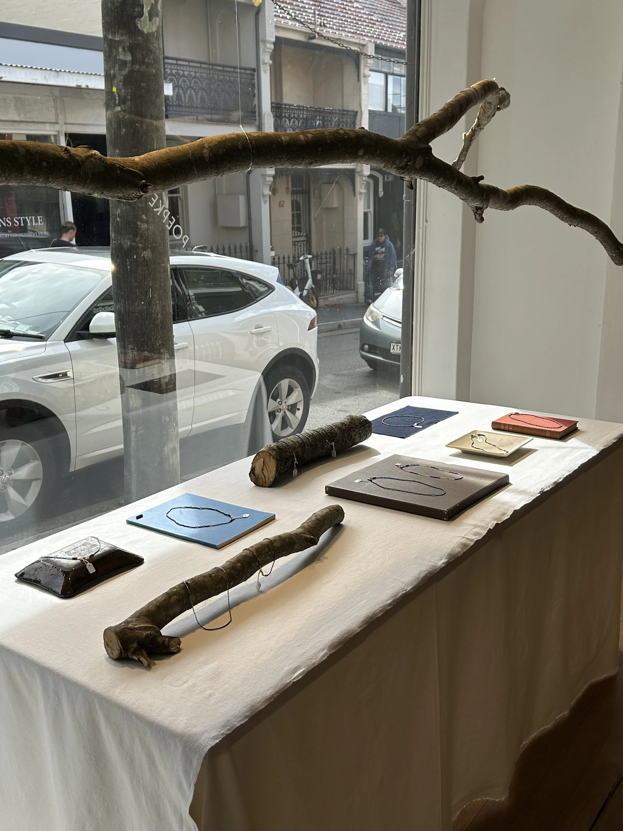Window display of Cendre Studio necklaces at Poepke clothing store on William Street in Paddington, NSW