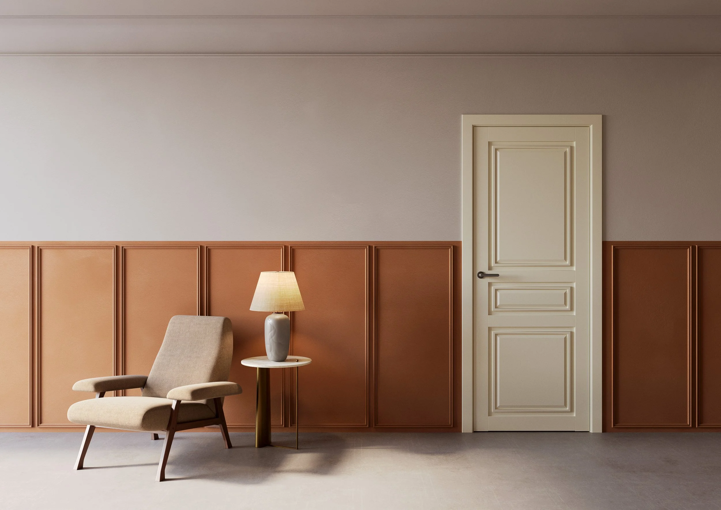 Interior room featuring a beige upholstered armchair with wooden legs, a small round side table with a white marble top, a beige table lamp with a fabric shade, a two-tone wall with beige upper and brown lower sections separated by molding, and a closed white door with decorative molding.