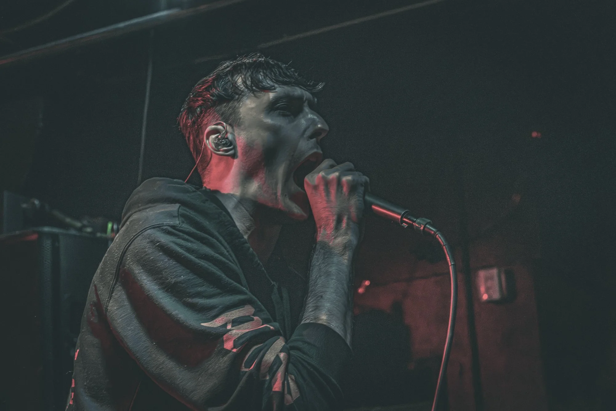 a male singer holding a microphone
