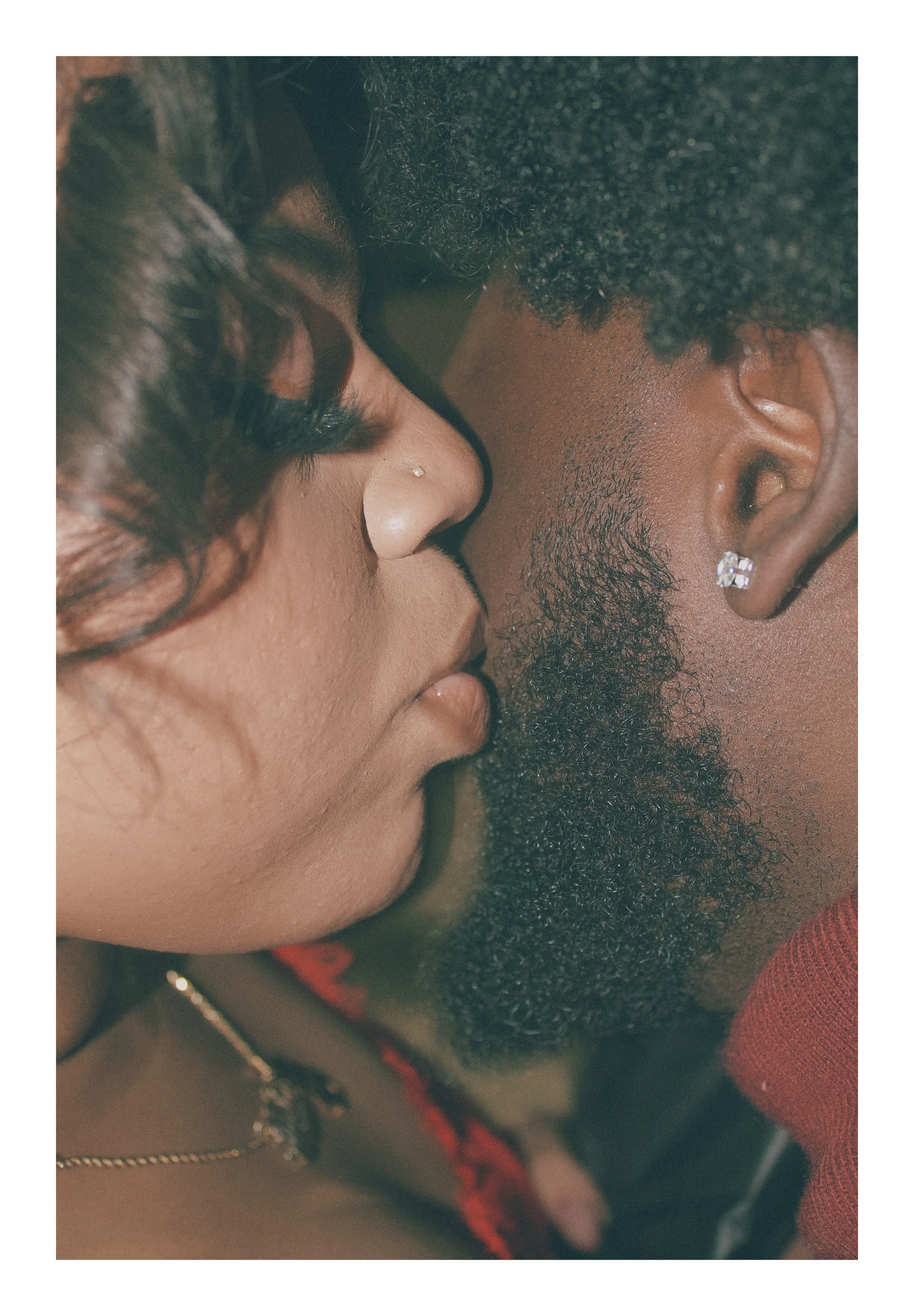 Intimate close-up portrait of a woman leaning in close to her partner's face during a romantic Connecticut family photography session.