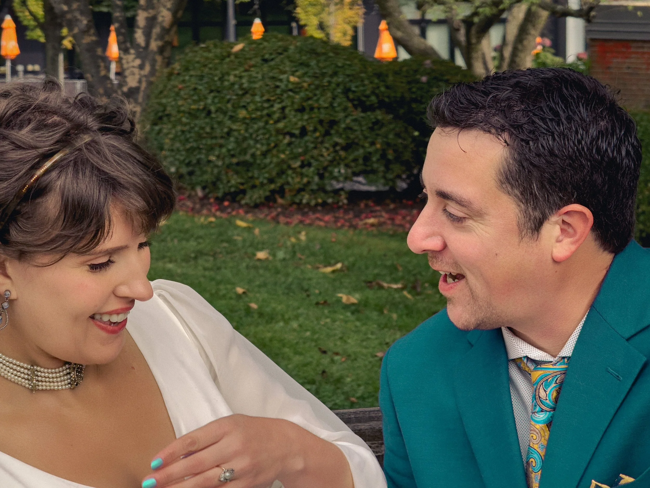 Smiling couple sharing a candid laugh during a timeless family photo session in West Hartford, Connecticut.