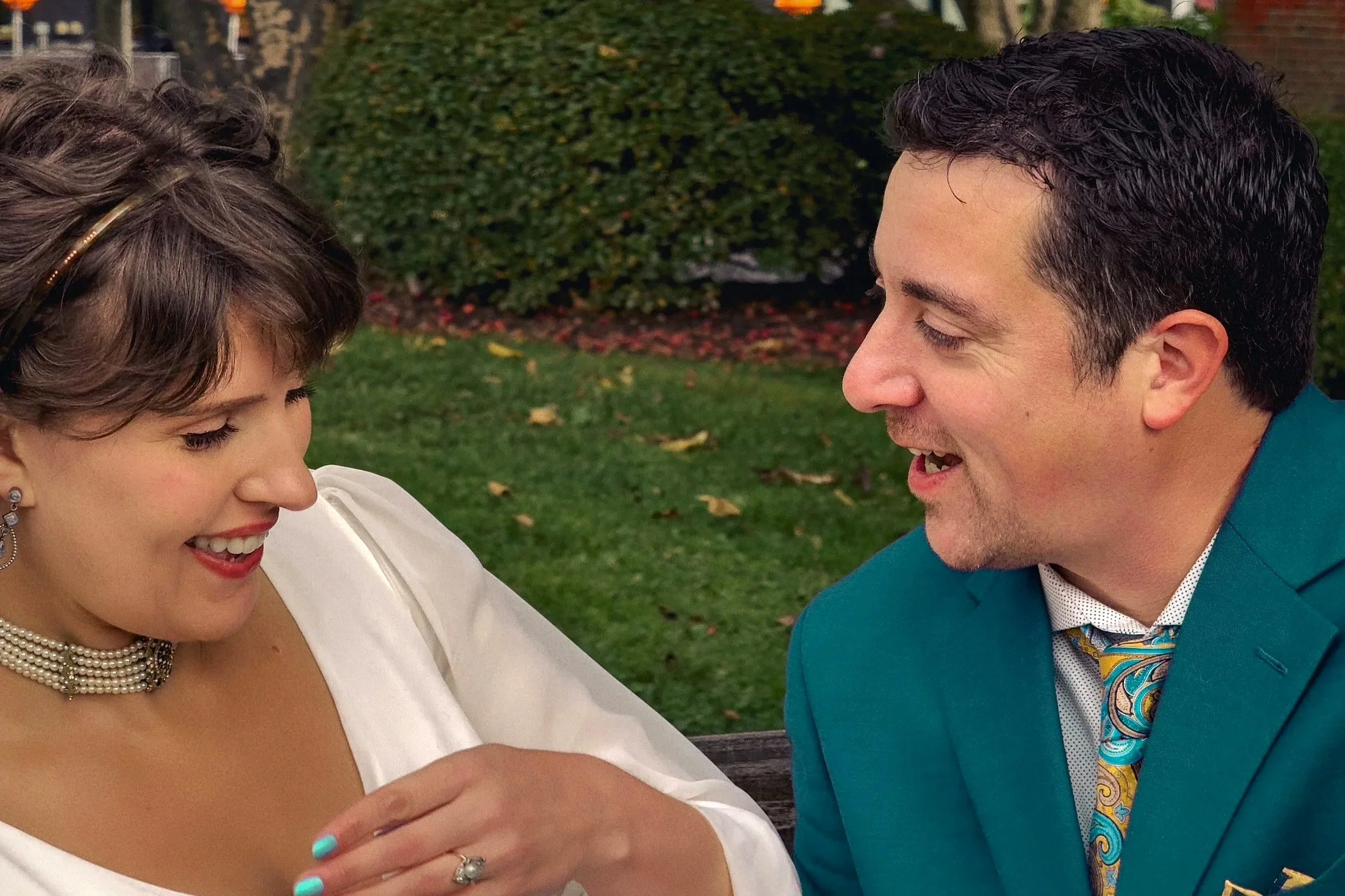 Smiling couple sharing a candid laugh during a timeless family photo session in West Hartford, Connecticut.