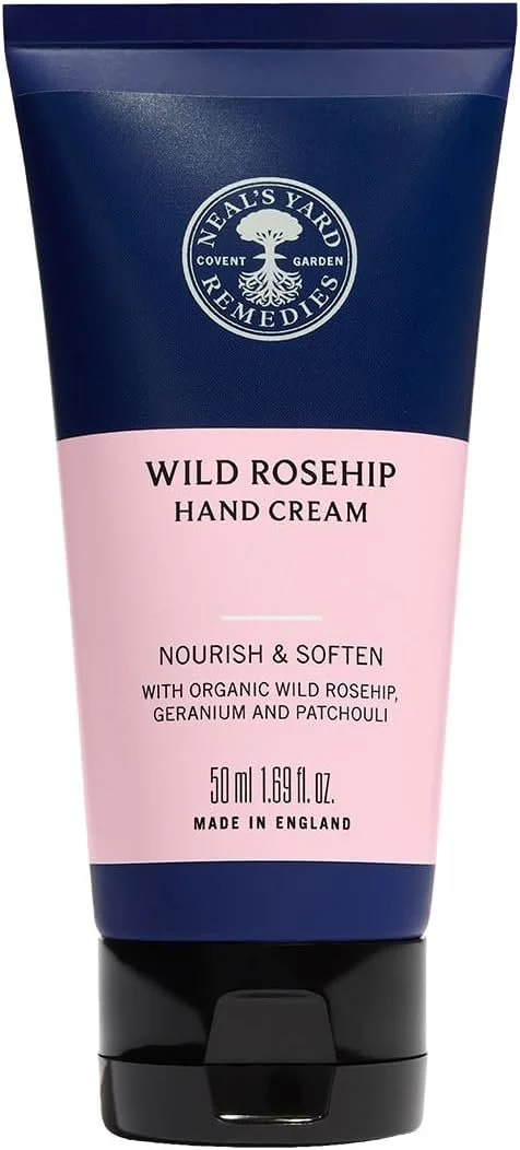 A 50 ml tube of Neal's Yard Remedies Wild Rosehip Hand Cream with organic wild rosehip, geranium, and patchouli, designed to nourish and soften hands.