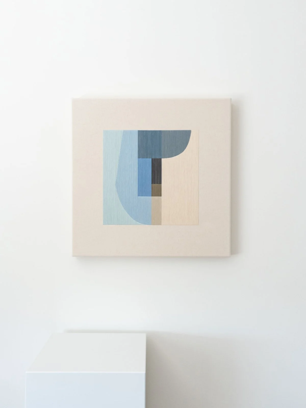Front view of January River (50x50cm) cotton thread abstract artwork with a pedestal by Kateryna Chernetska.