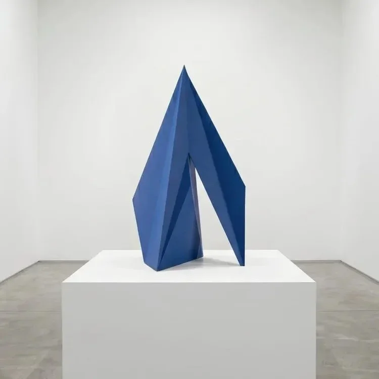 Contemporary blue geometric freestanding sculpture by Alessandro Butera, ideal fine art for luxury hotel lobbies, upscale villas, and modern hospitality interior design.