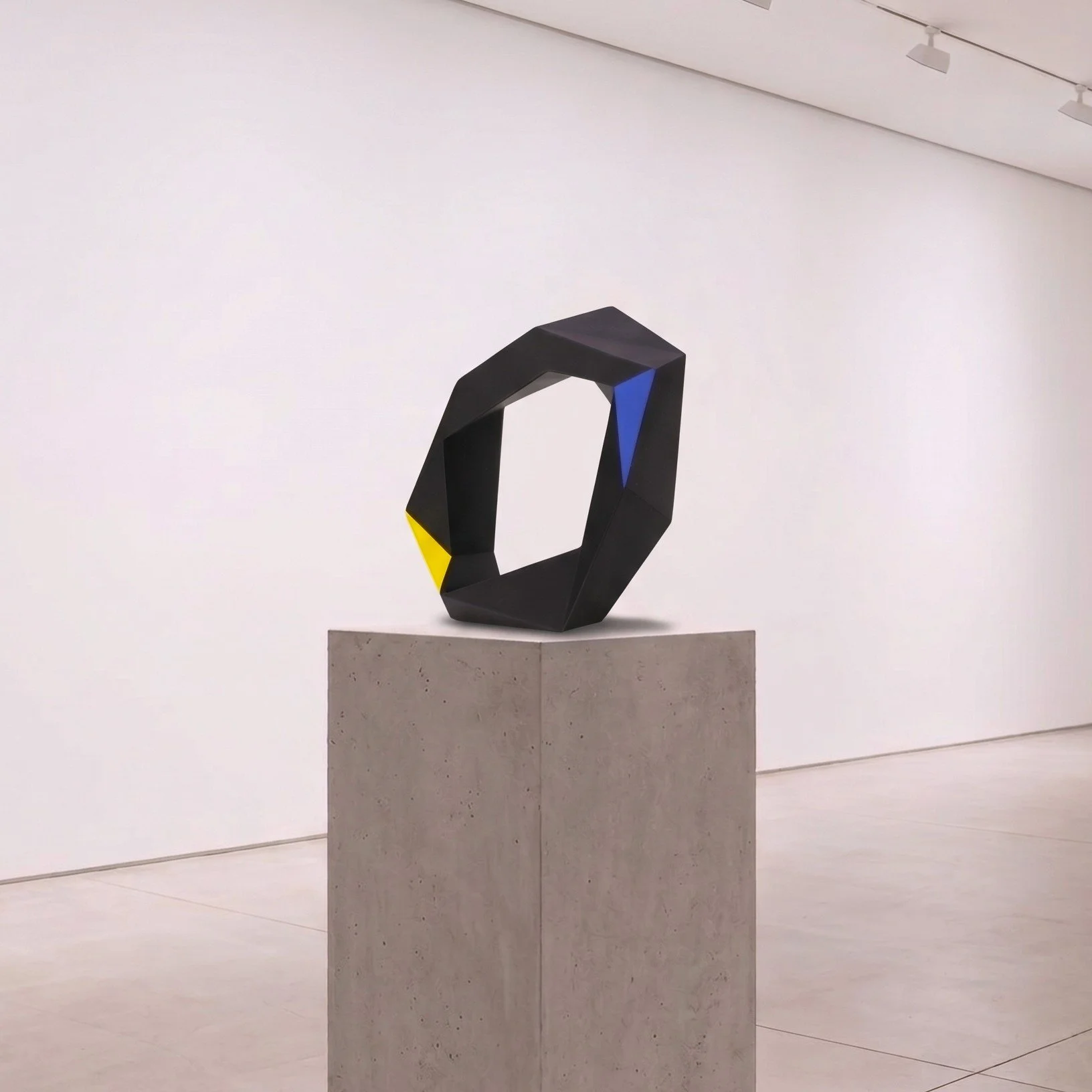 Black polymorphic ring sculpture by Alessandro Butera, faceted ring form with blue and yellow accents, hand-painted, for luxury interiors and design collections