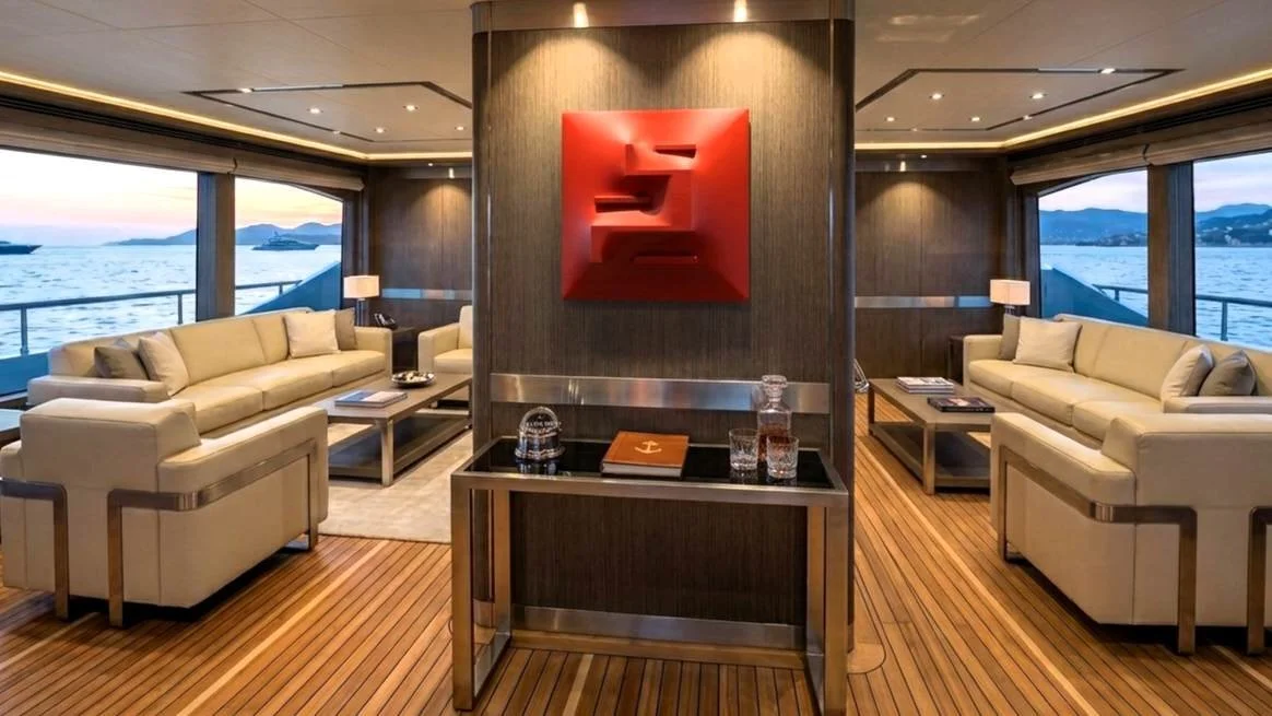 Red spatialist art extroflection by Alessandro Butera inside a luxury superyacht main saloon, bespoke contemporary marine interior design in London, Monaco, and Fort Lauderdale.