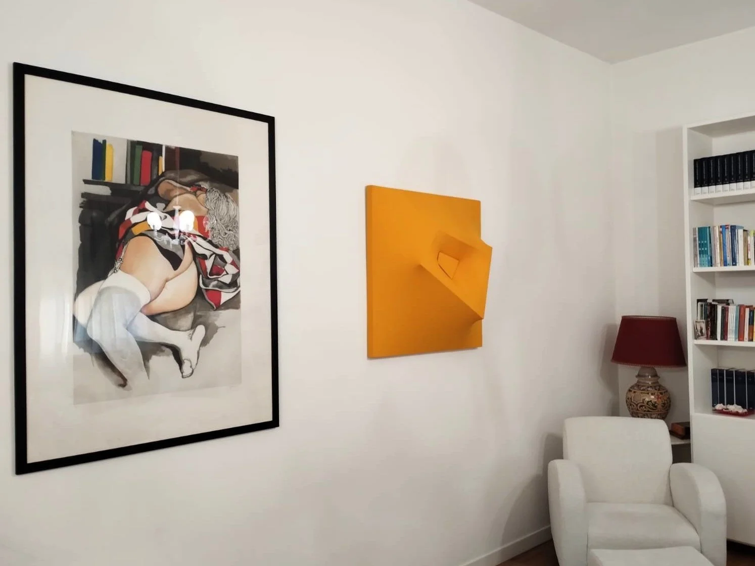 Yellow extroflessed artwork by Alessandro Butera in a private collection, alongside a work by Renato Guttuso