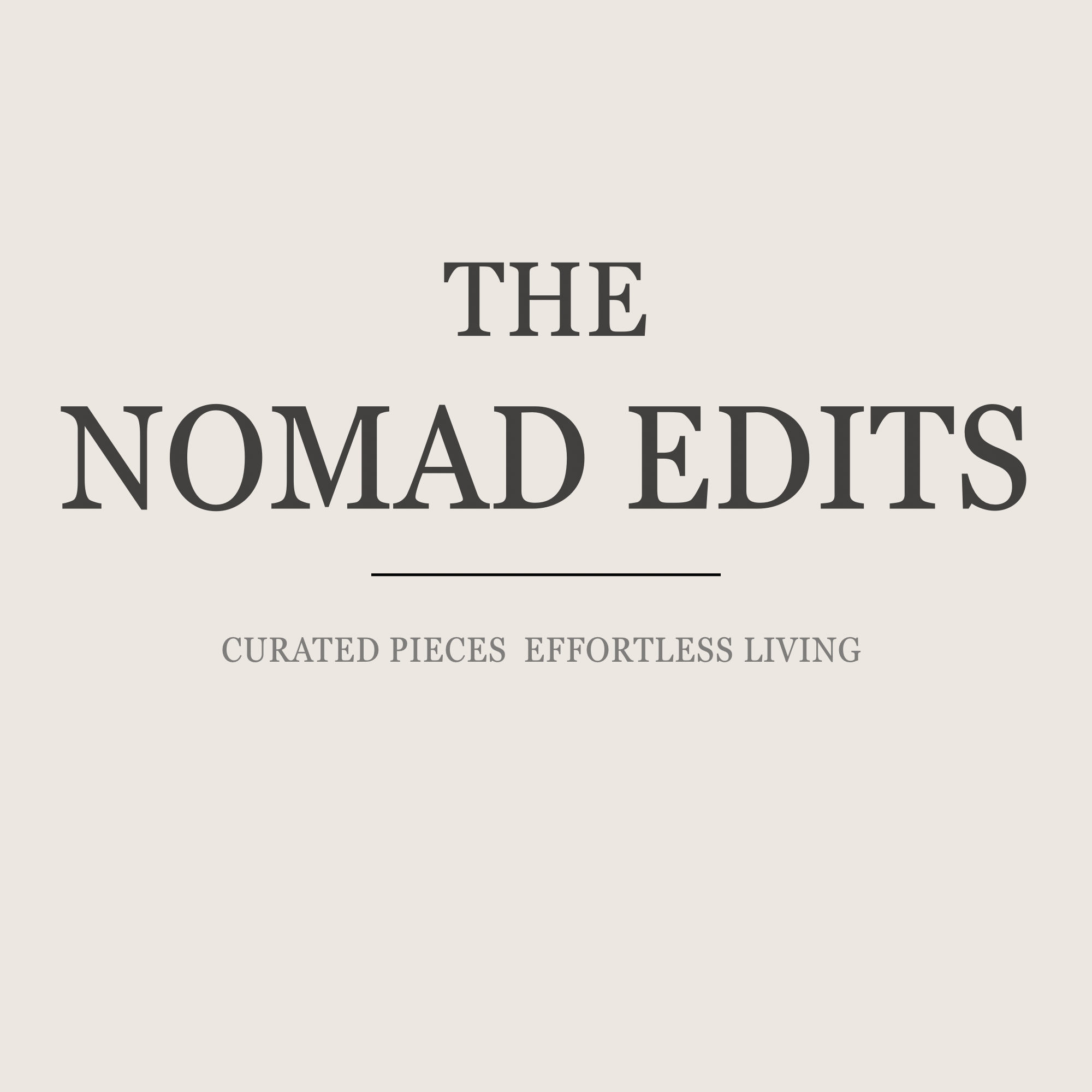 The cover page of a book titled 'The Nomad Files,' featuring a subtitle 'Curated Pieces Effortless Living' on a simple light background.
