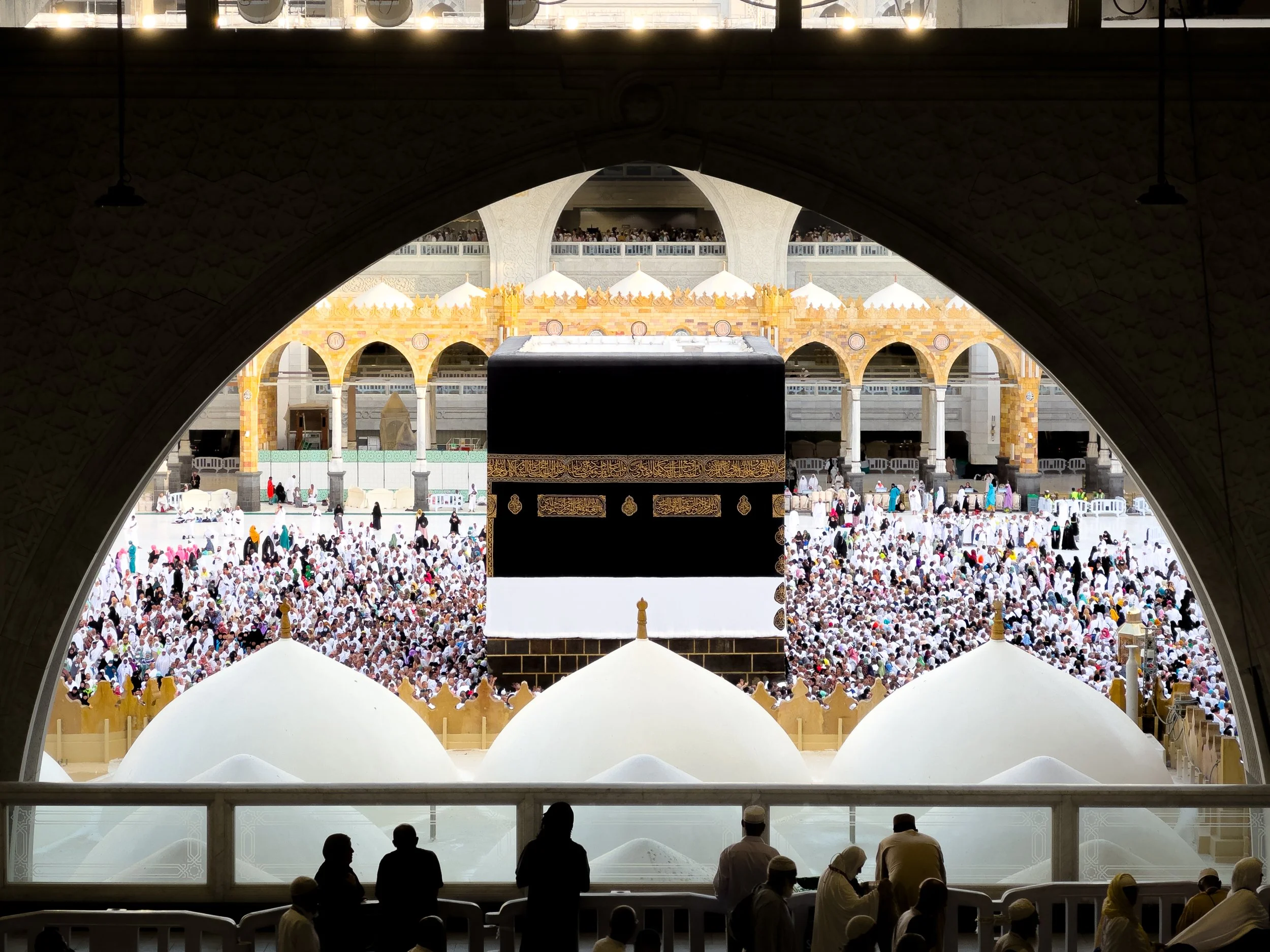 Masjidil Haram, Mecca, Saudi Arabia — The Kaabah through the arch, surrounded by thousands. The scale only becomes real when you stop and look properly.