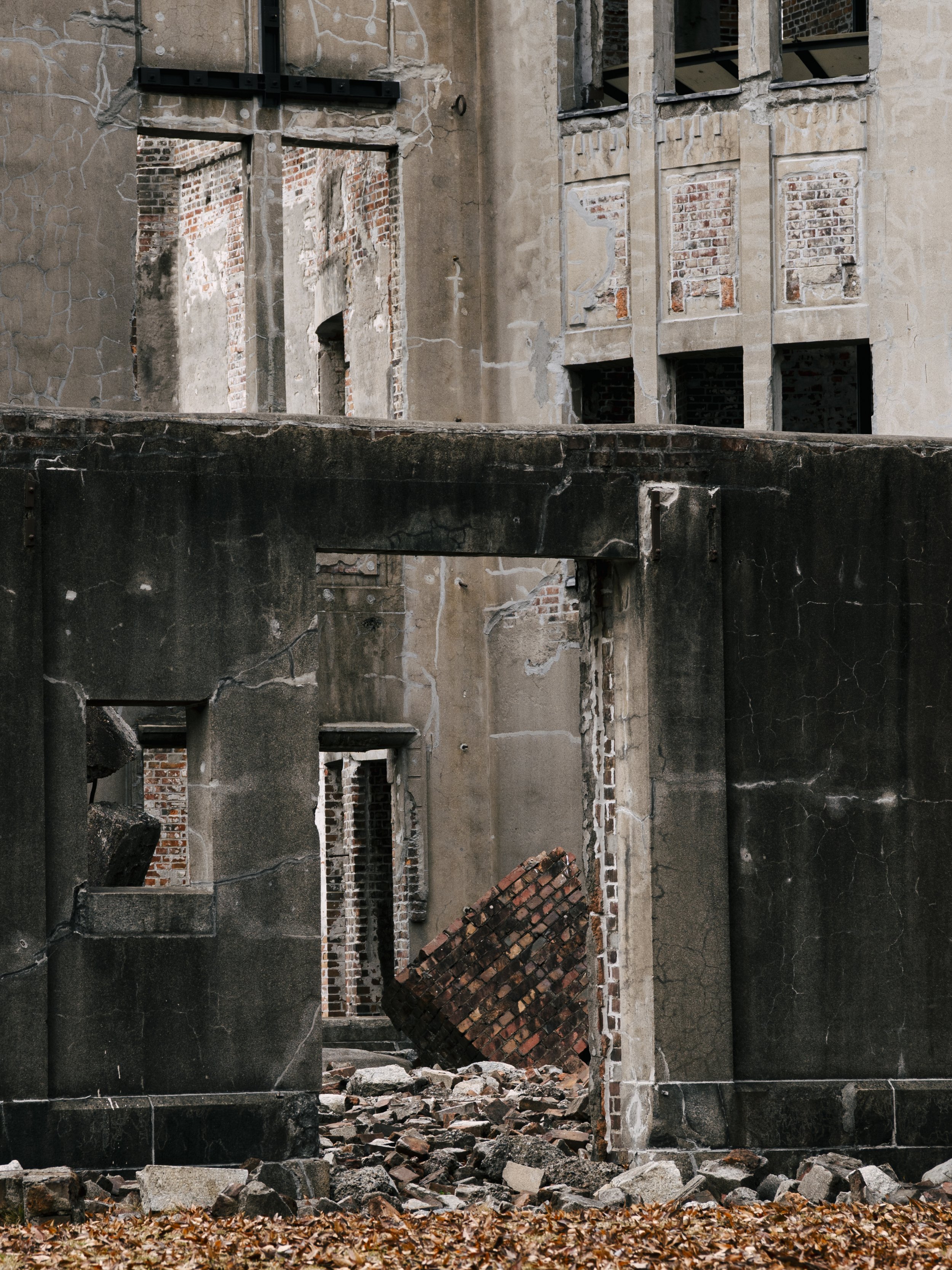 Exposed brick and crumbling concrete walls of the Atomic Bomb Dome, preserved as a UNESCO World Heritage Site.