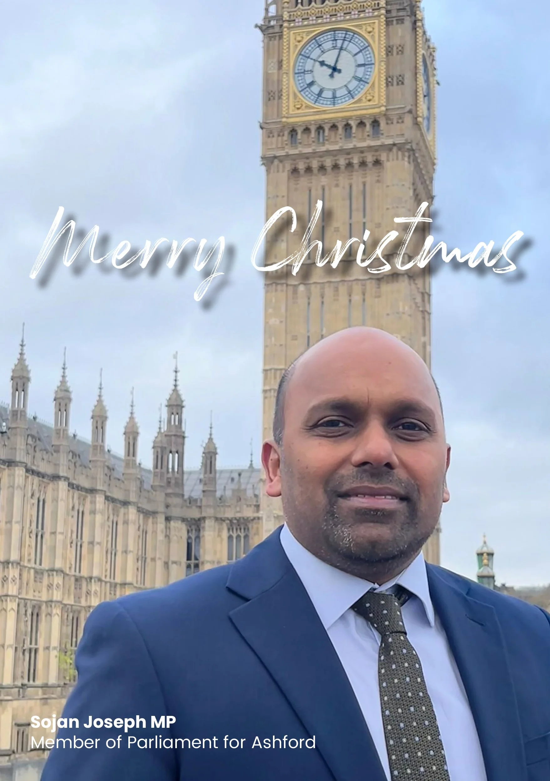 A man in a suit with a bow tie standing in front of Big Ben in London, with a caption that reads 'Merry Christmas' and identifies him as Sojan Joseph MP, Member of Parliament for Ashford.