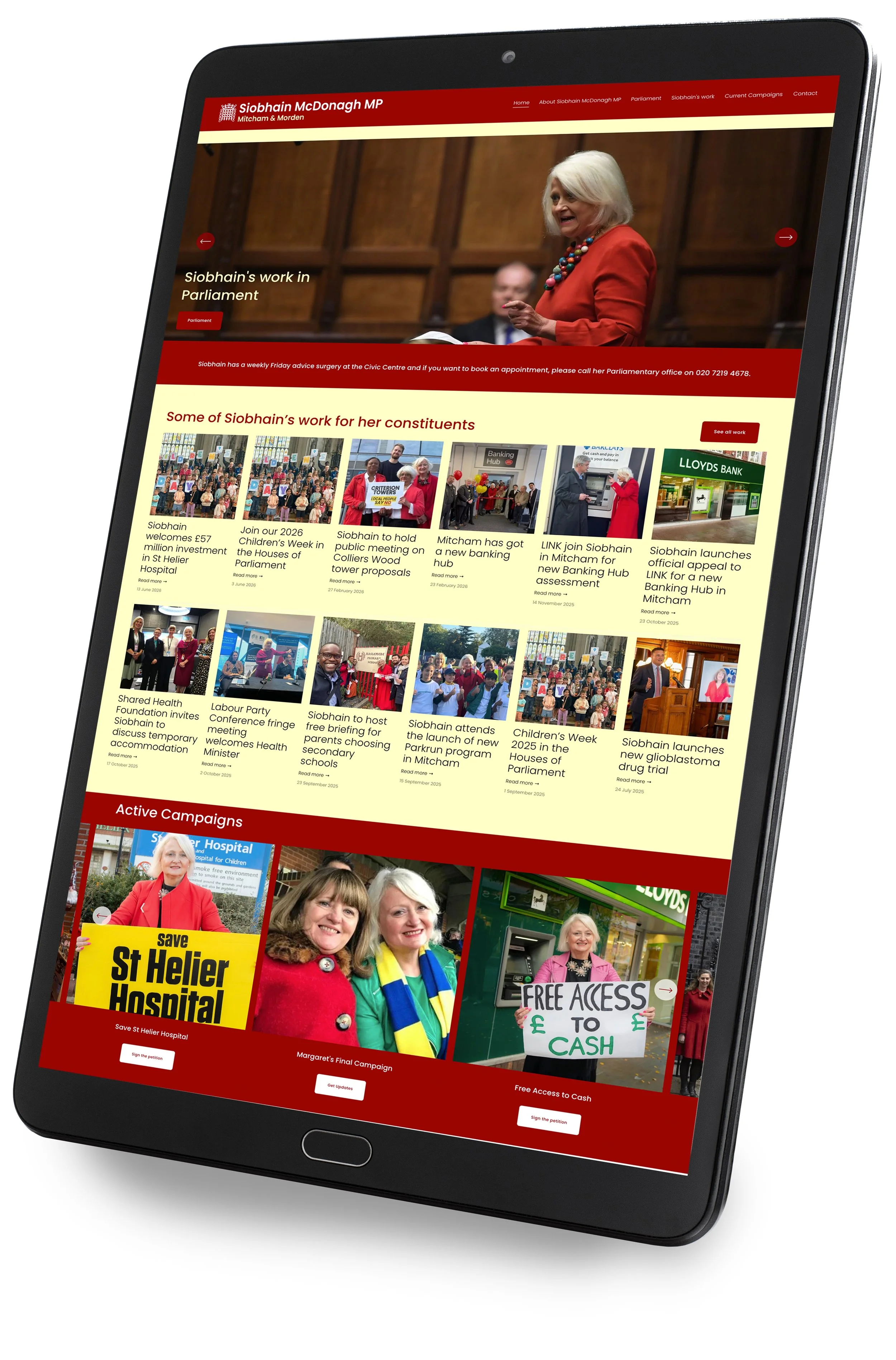 A tablet displaying a political campaign website with a woman speaking at a podium, various news articles, and campaign calls to action.