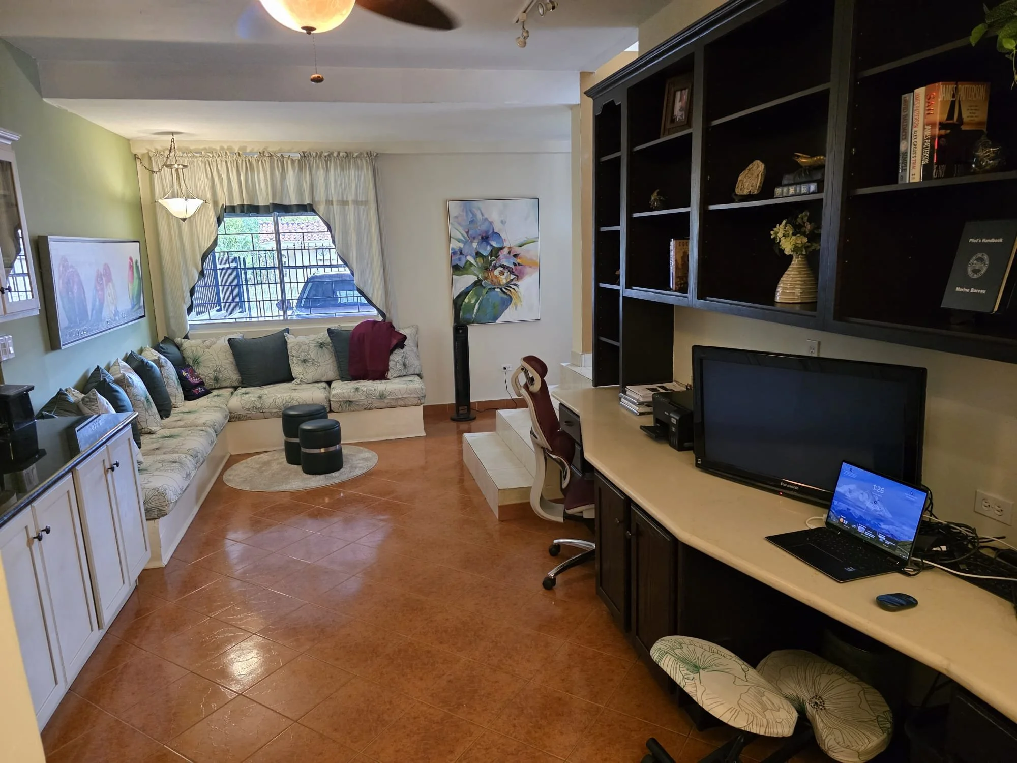 Family gathering area with large two-person office/desk 
