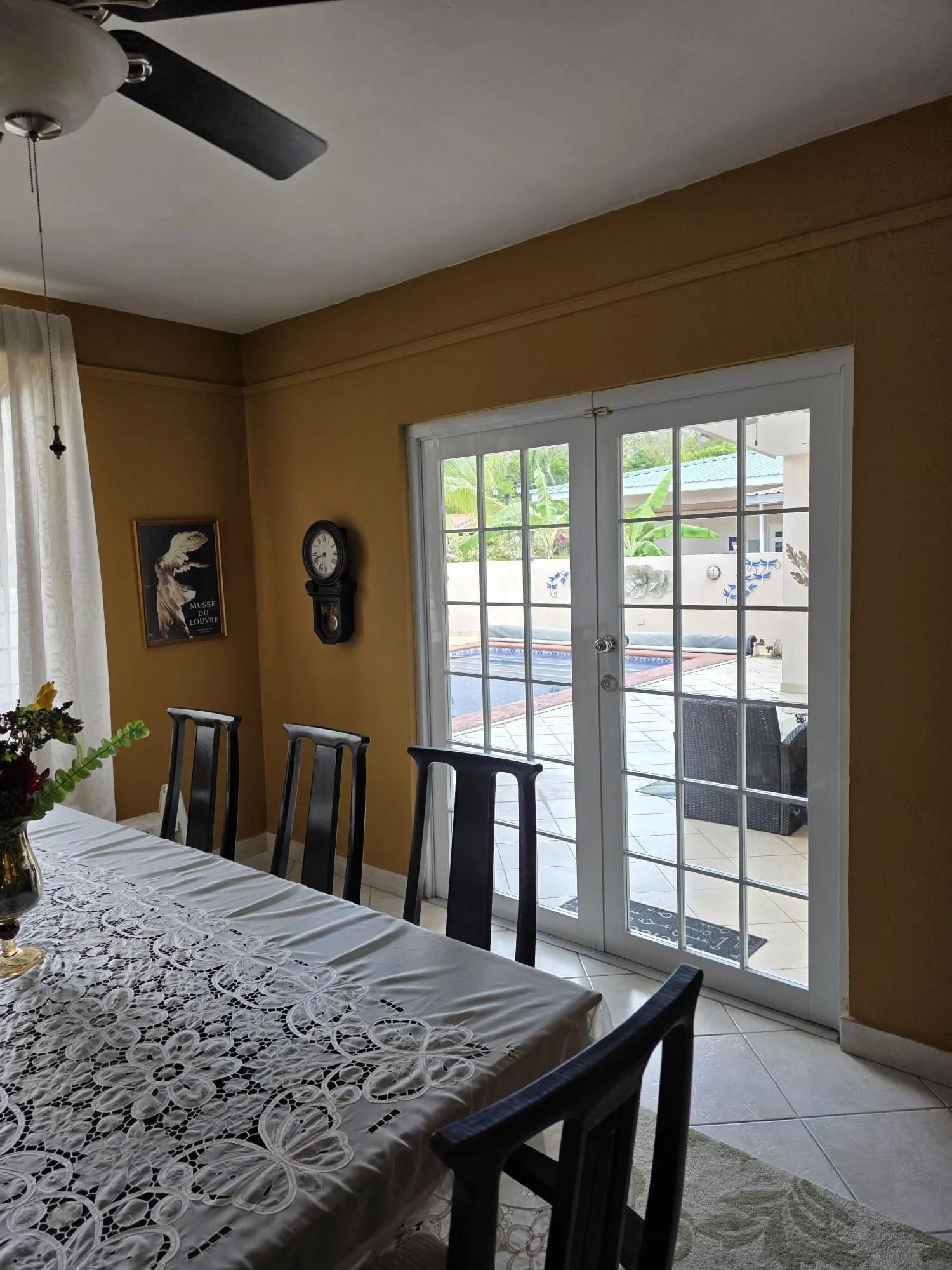 Large dining/entertaining space attached to tiled, enclosed patio
