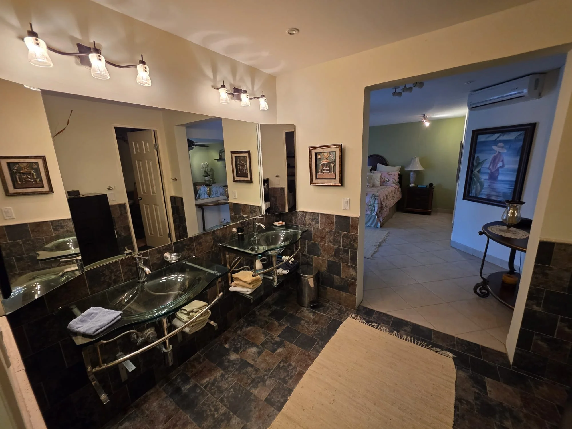 Main bedroom bath with double vanity and enclosed toilet/large shower