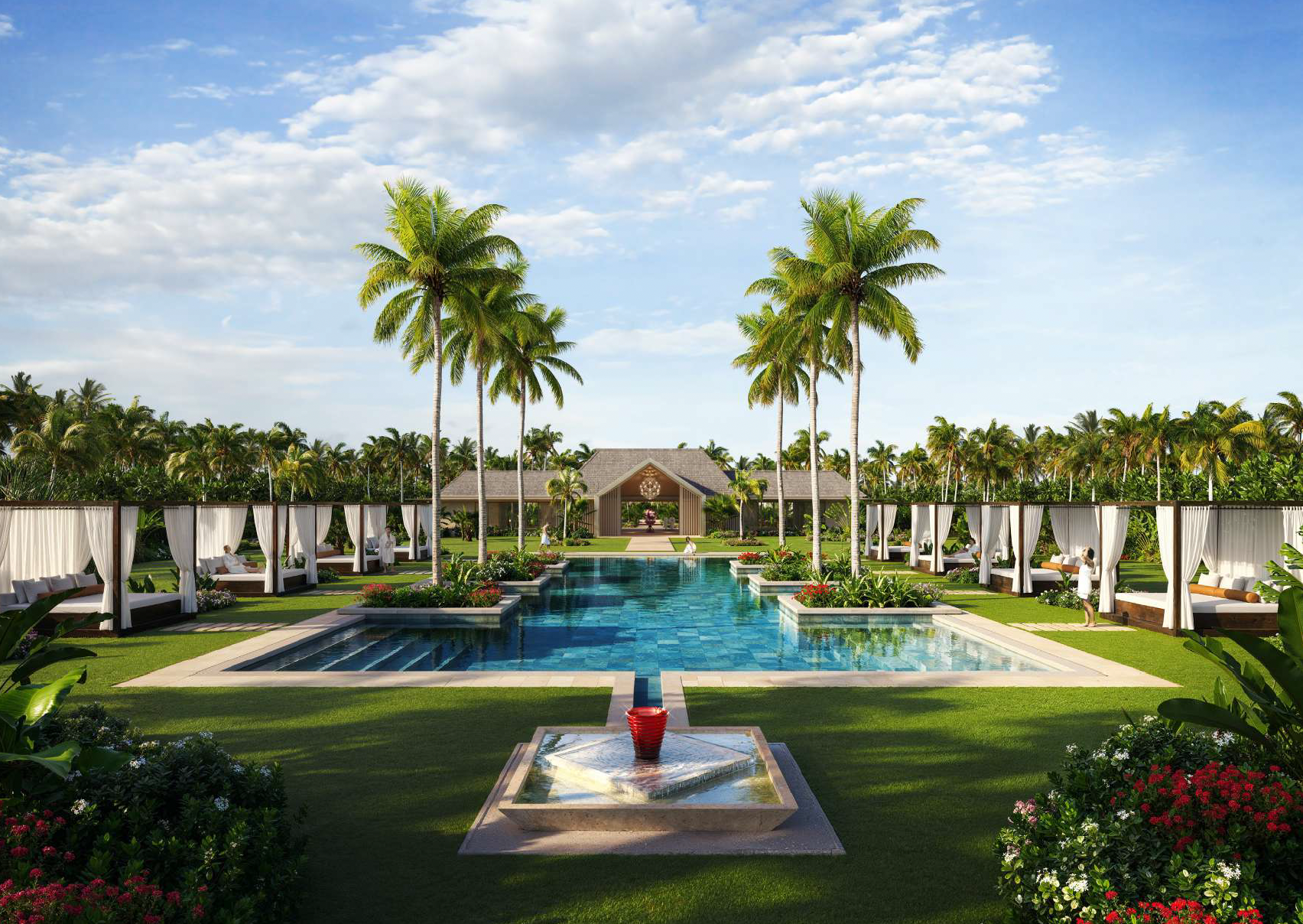 Luxury pool area with cabanas, lounge chairs, tall palm trees, lush green grass, colorful flowers, and a pavilion in the background under a partly cloudy sky.