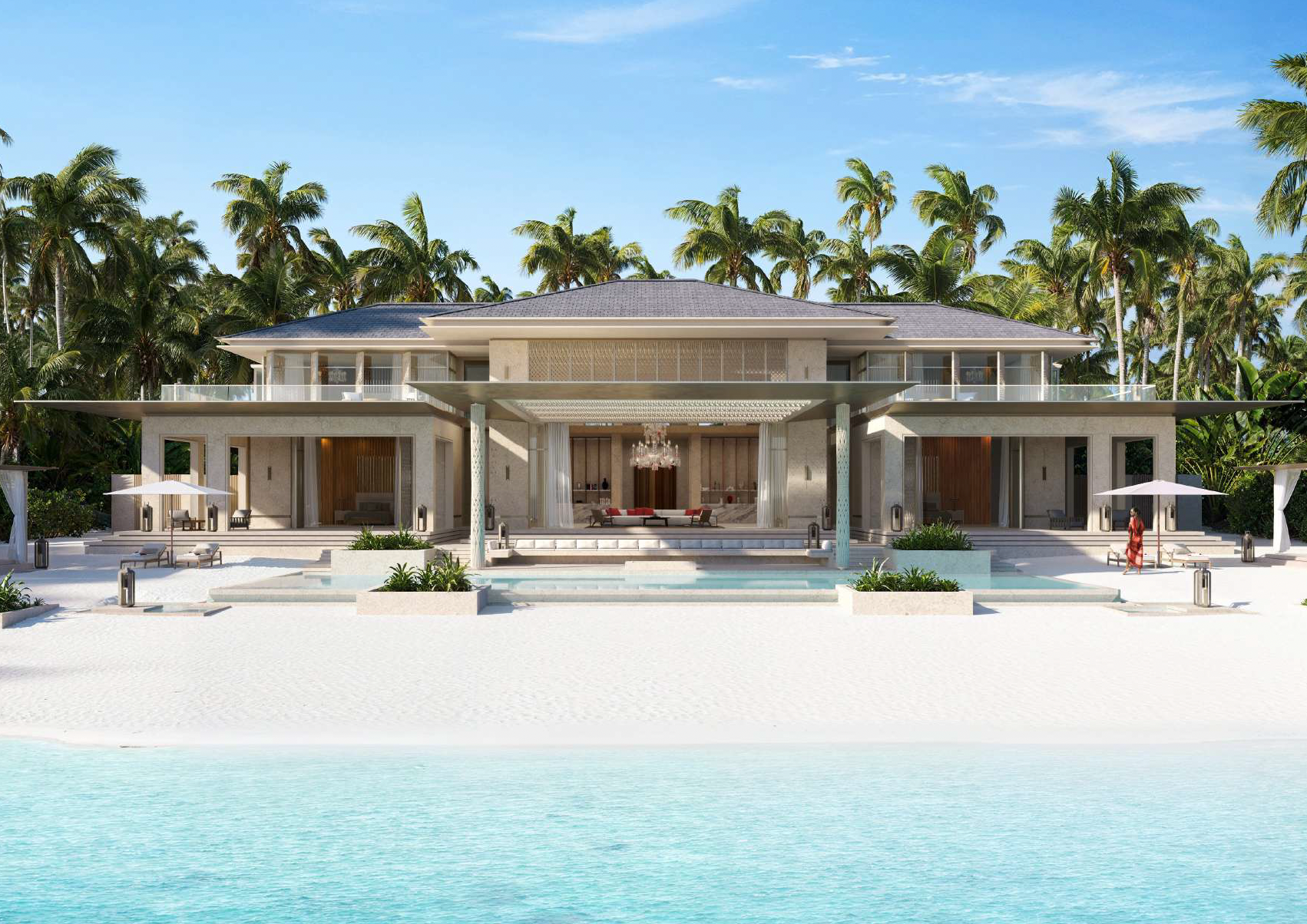 Luxury beachfront house with pool, surrounded by palm trees and a blue sky.
