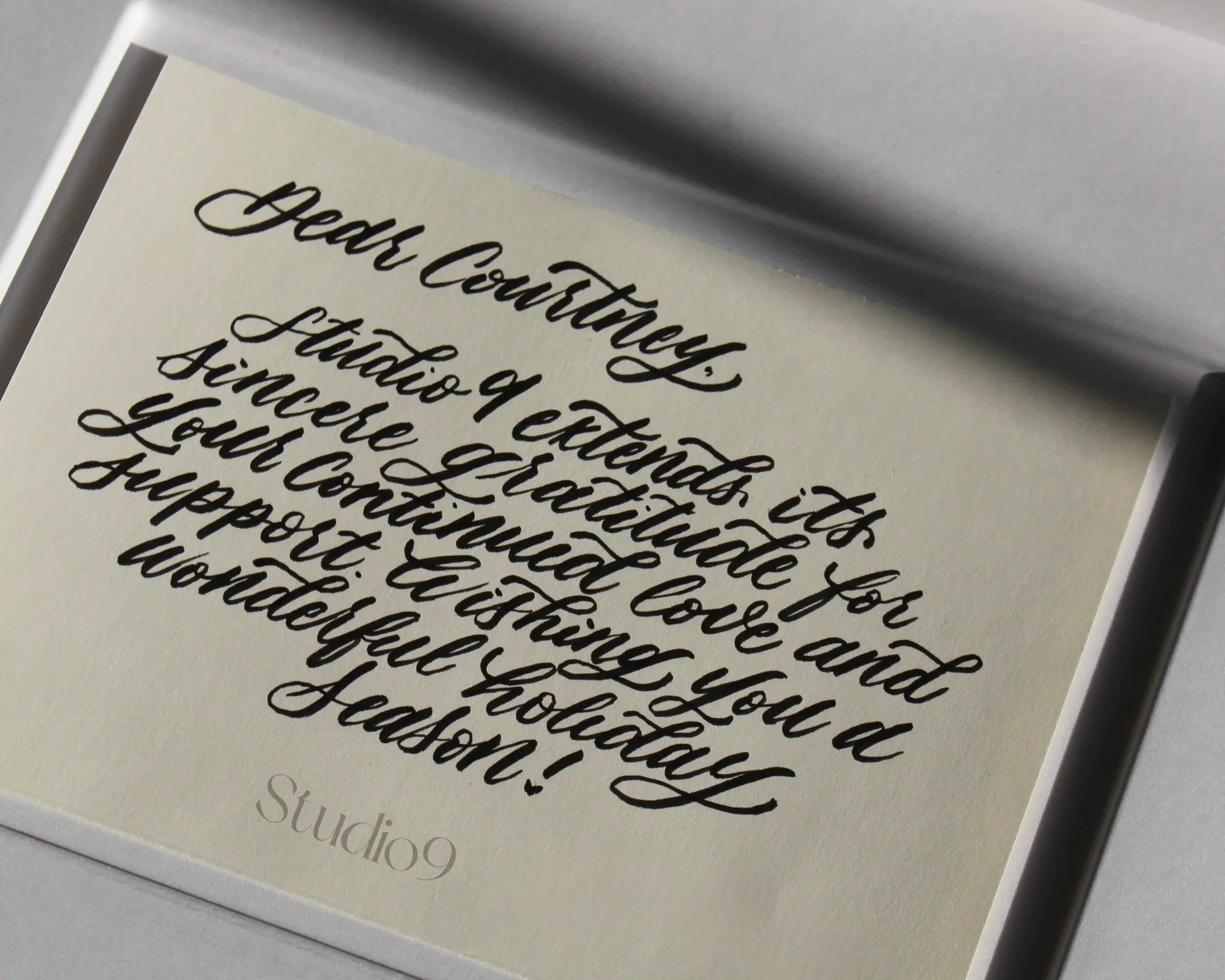 A PR gift note sits in the sunlight graciously thanking the receiver of their continued love and support during the holiday season