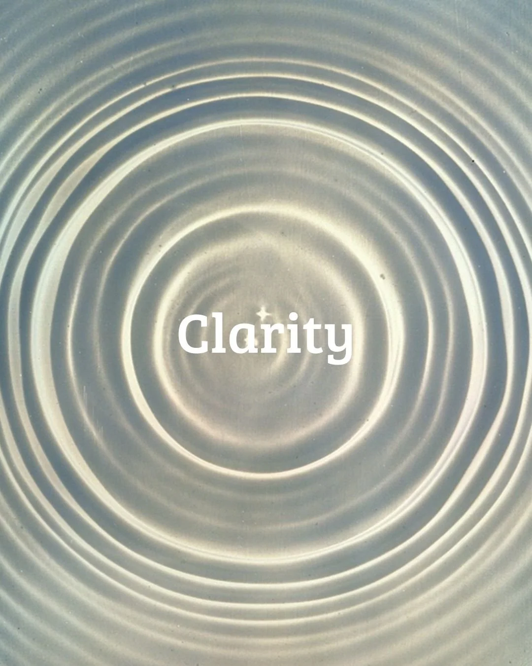 Close-up of circular metal surface with concentric ripples, with the word 'Clarity' overlaid in the center.