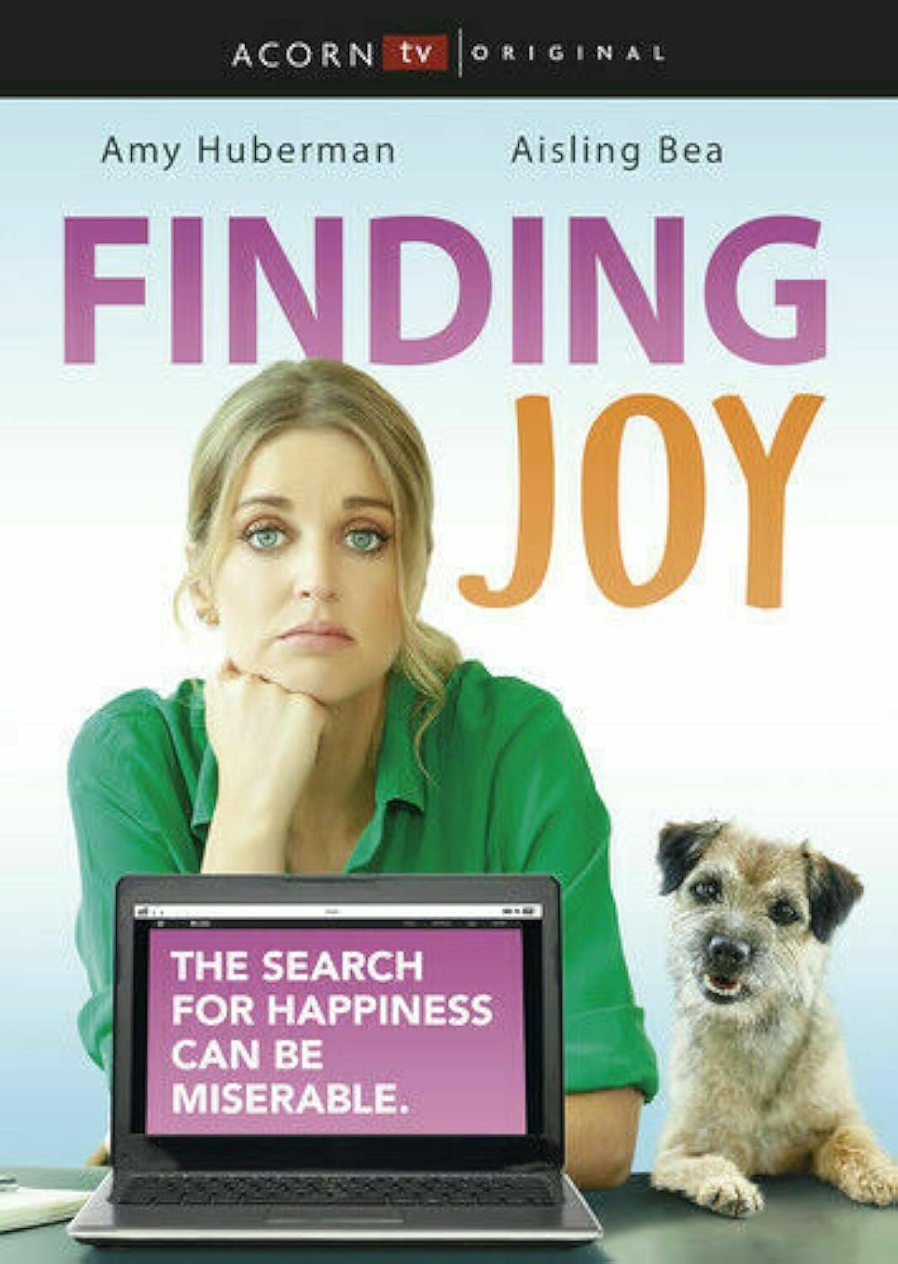 Book cover for 'Finding Joy' by Amy Huberman and Aisling Bea, published by Acorn TV Original. The cover features a woman with blonde hair and blue eyes wearing a green shirt, resting her chin on her hand, sitting at a desk with a small dog beside her