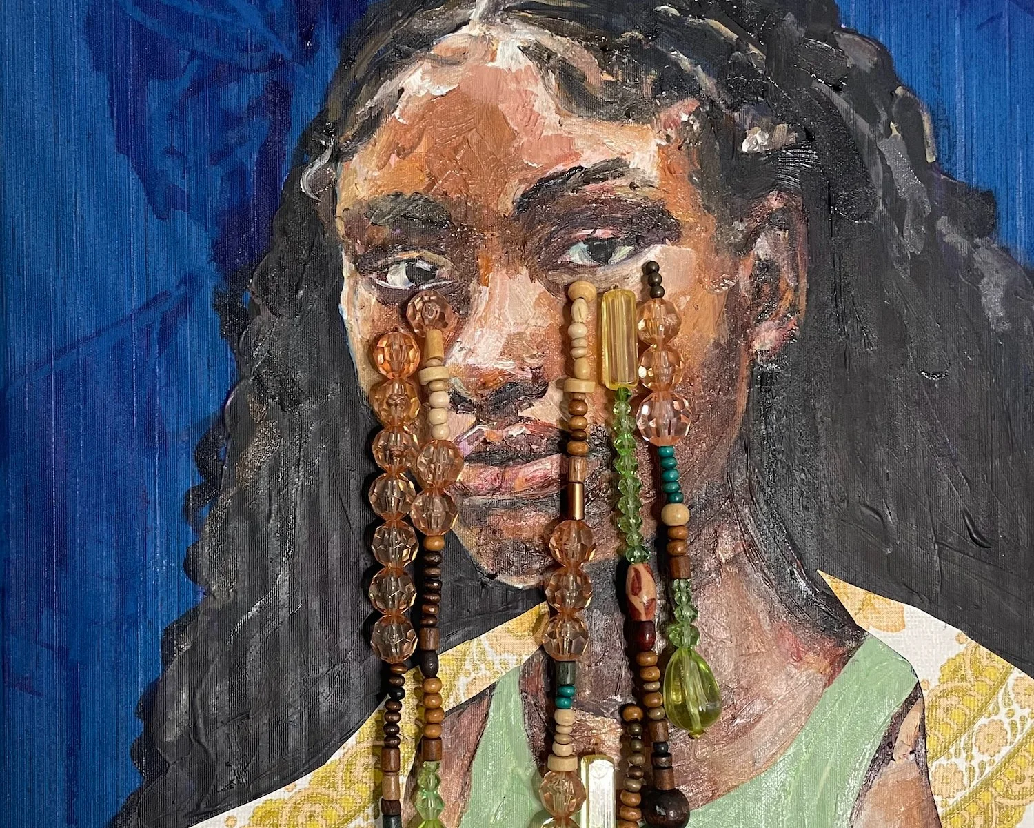 A painting of a woman with long dark hair wearing a green and yellow garment, with multiple beaded necklaces hanging in front of her face.