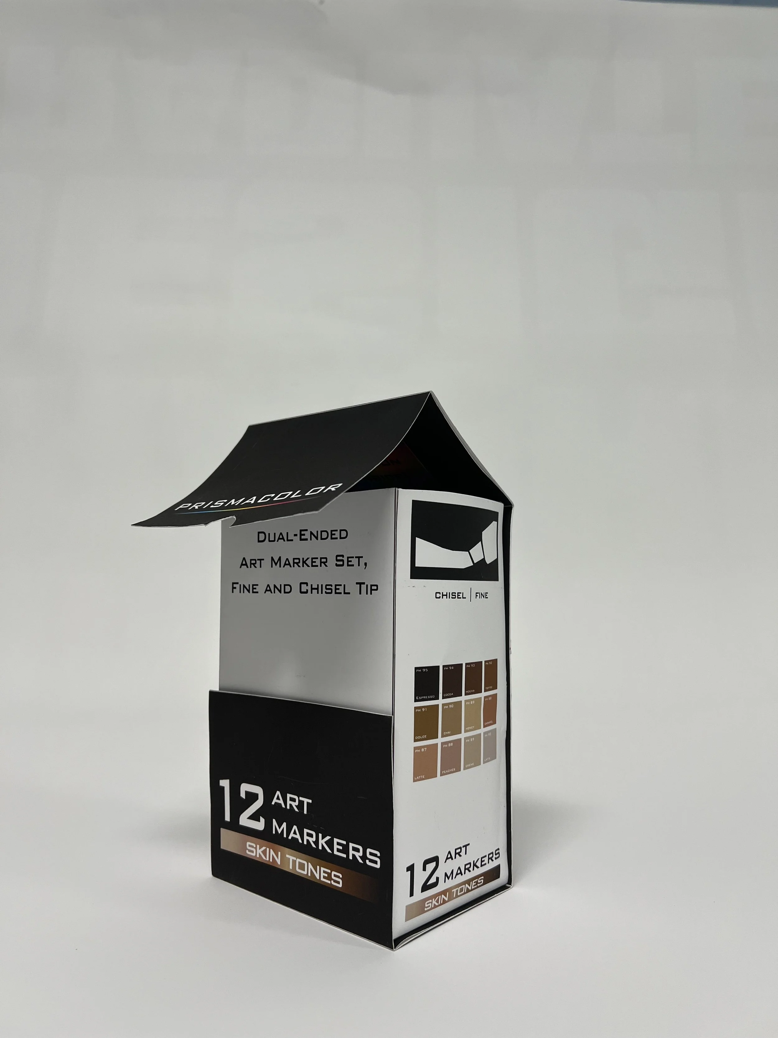 Box of Prismacolor art markers with 12 skin tone shades, featuring a black and white packaging design with color swatches.