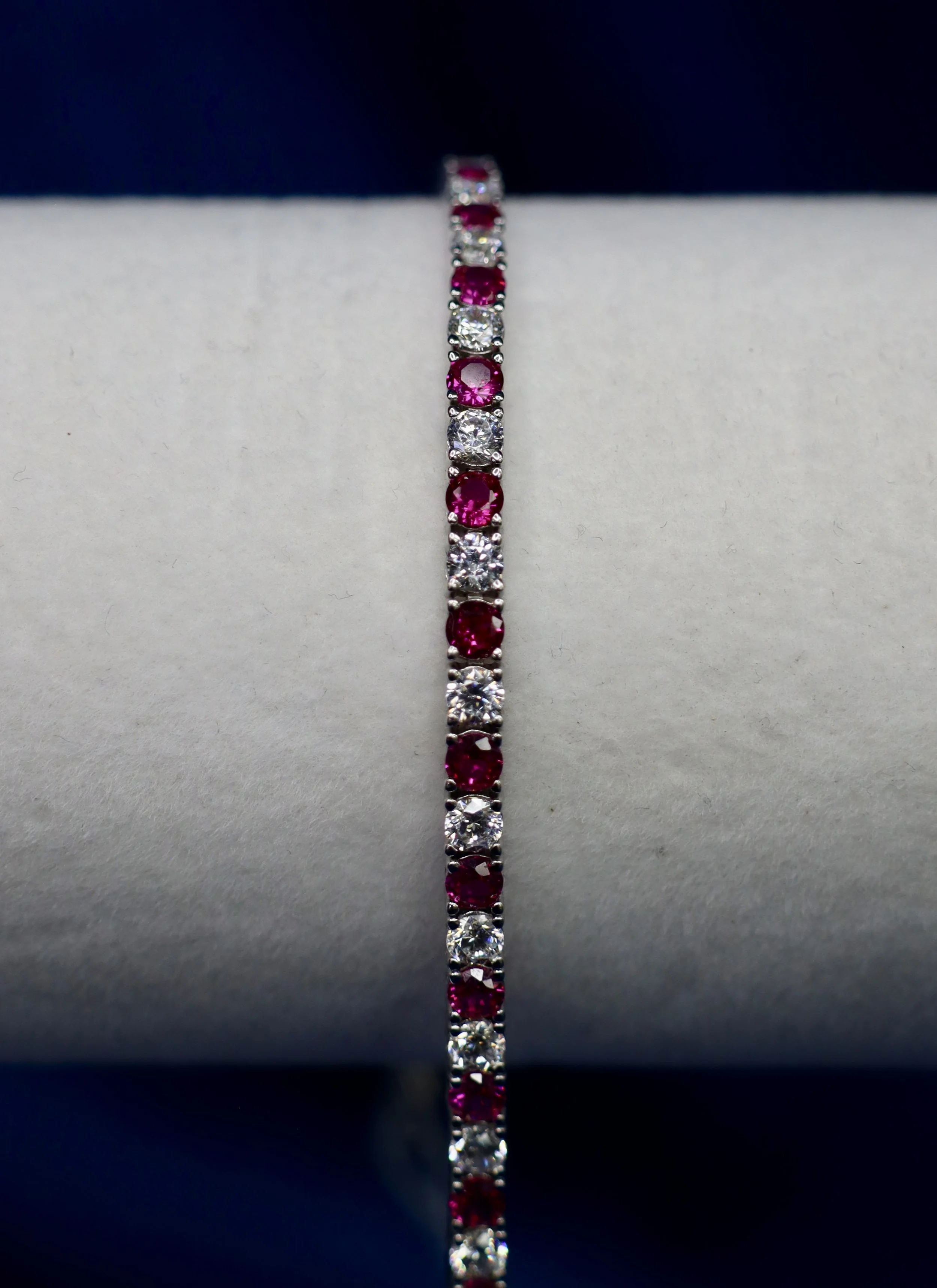 Round cut ruby and CZ tennis bracelet
