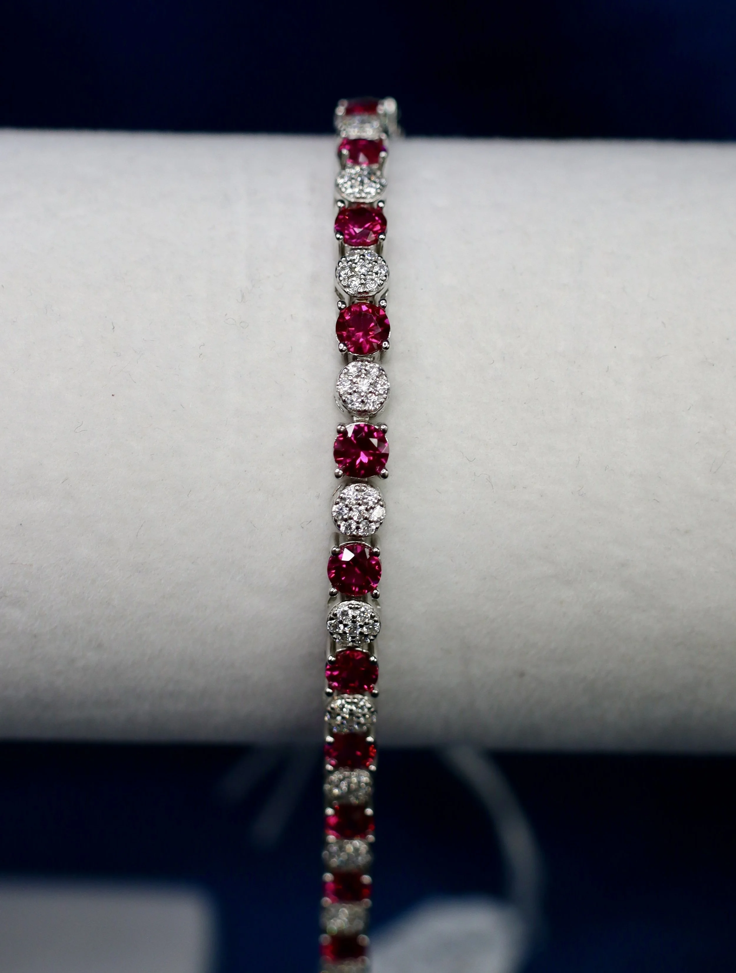 Round cut synthetic ruby and CZ, sterling silver tennis bracelet