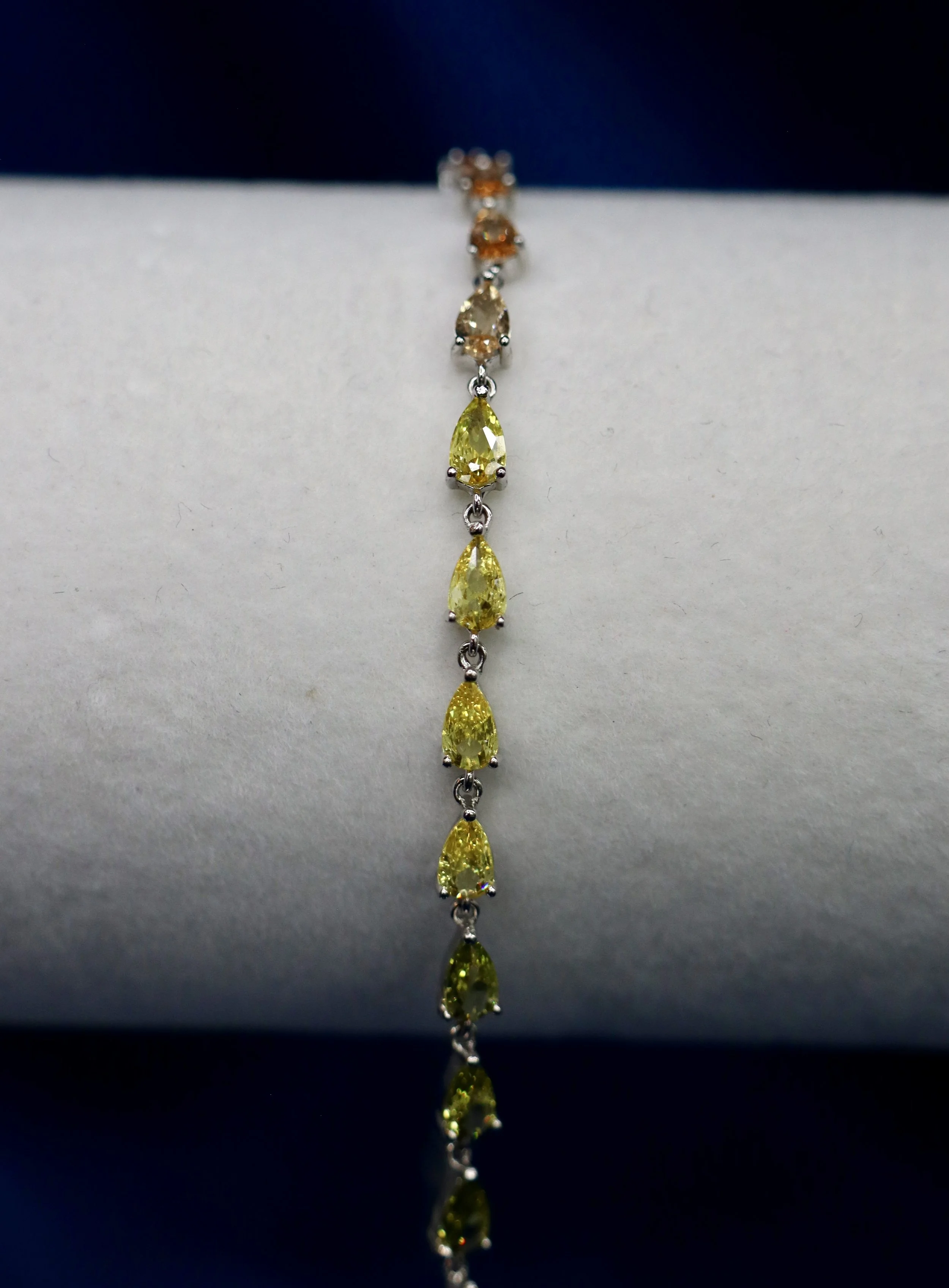 Pear shaped rainbow stone tennis bracelet