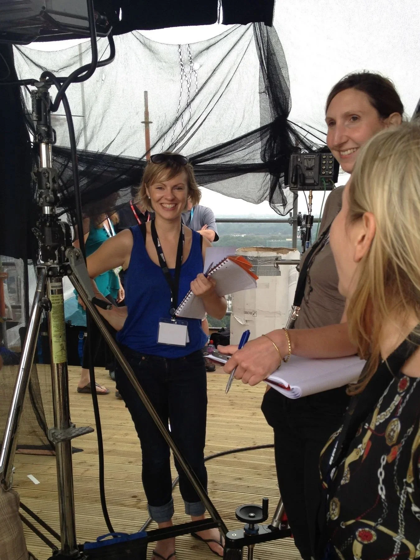 Molly and colleauges standing in front of a news broadcast camera at the London 2012 Olympics