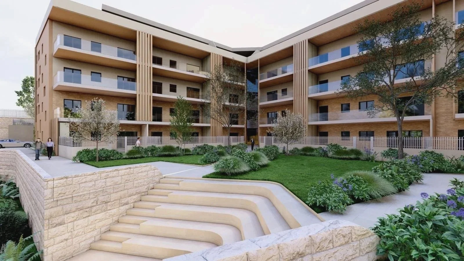 Modern residential apartment building with balconies, surrounded by landscaped gardens and trees, with people walking nearby.