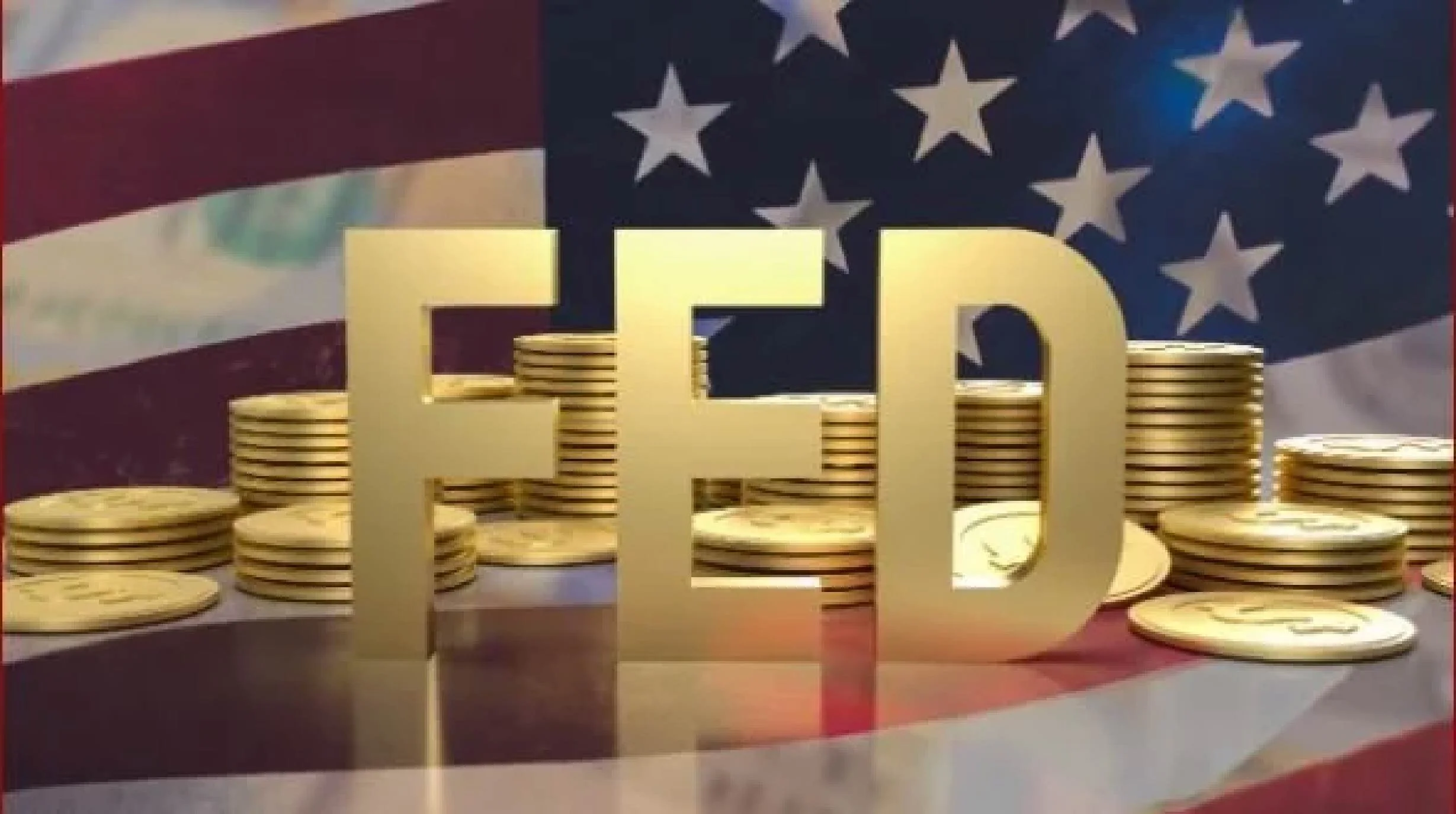 Gold letters spelling 'FED' placed over stacks of coins with an American flag in the background.