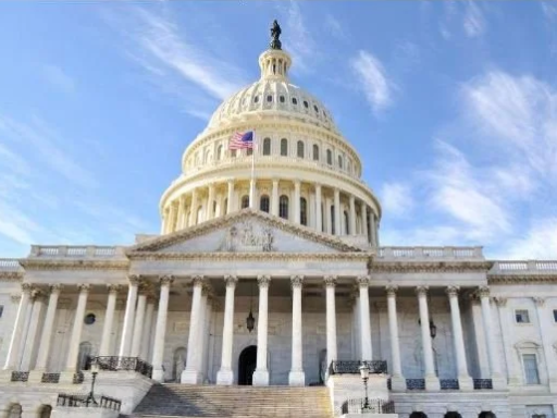 The United States Capitol building with a clear sky in the background.