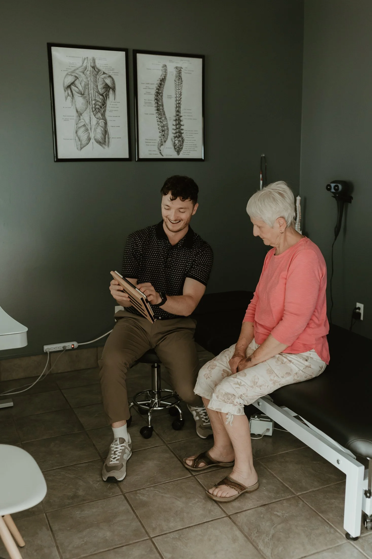 Dr. Jordan Villeneuve discussing care with a patient at Stride in Val Therese