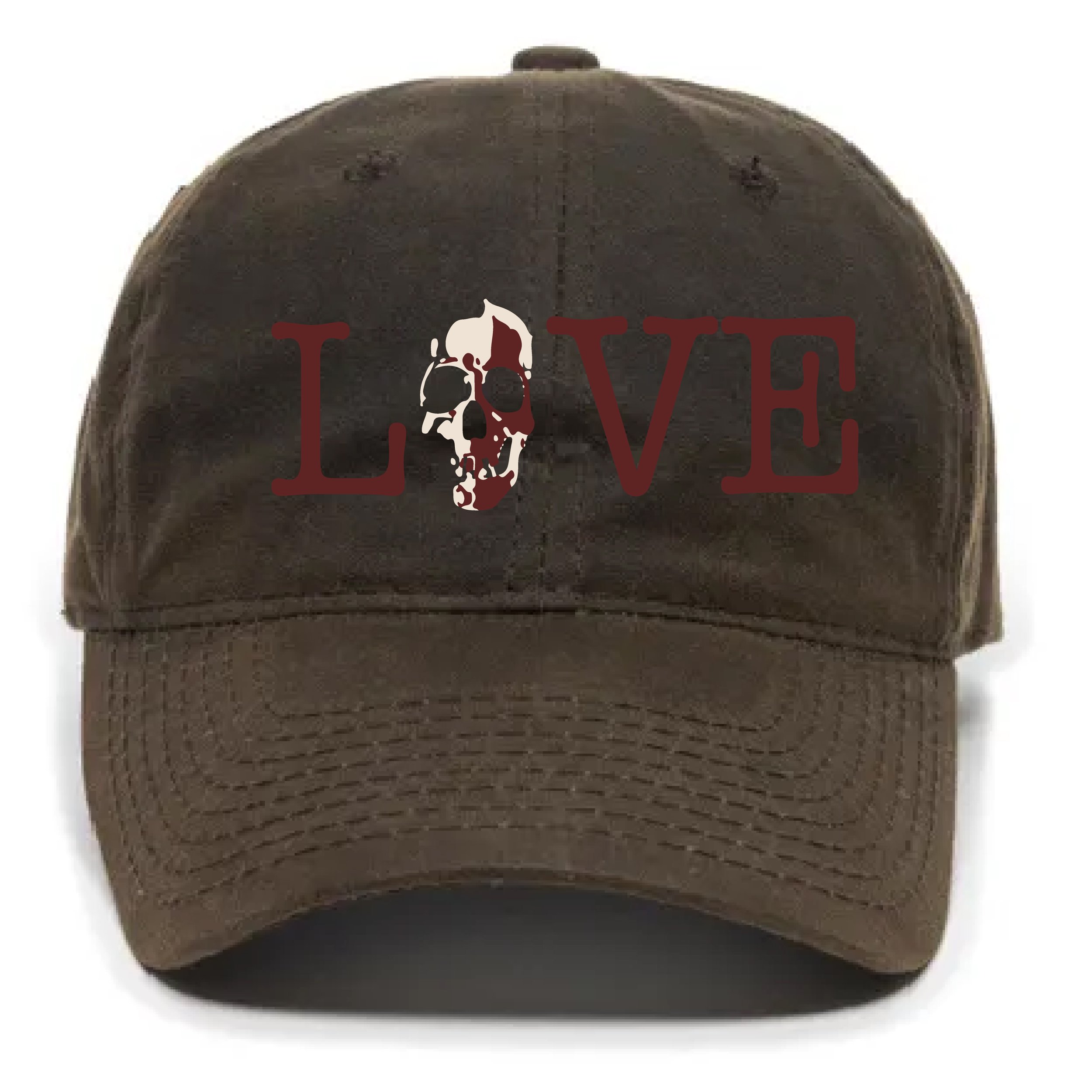 Close up of a brown baseball cap with a white embroidered skull and the word 'LOVE' in red letters.